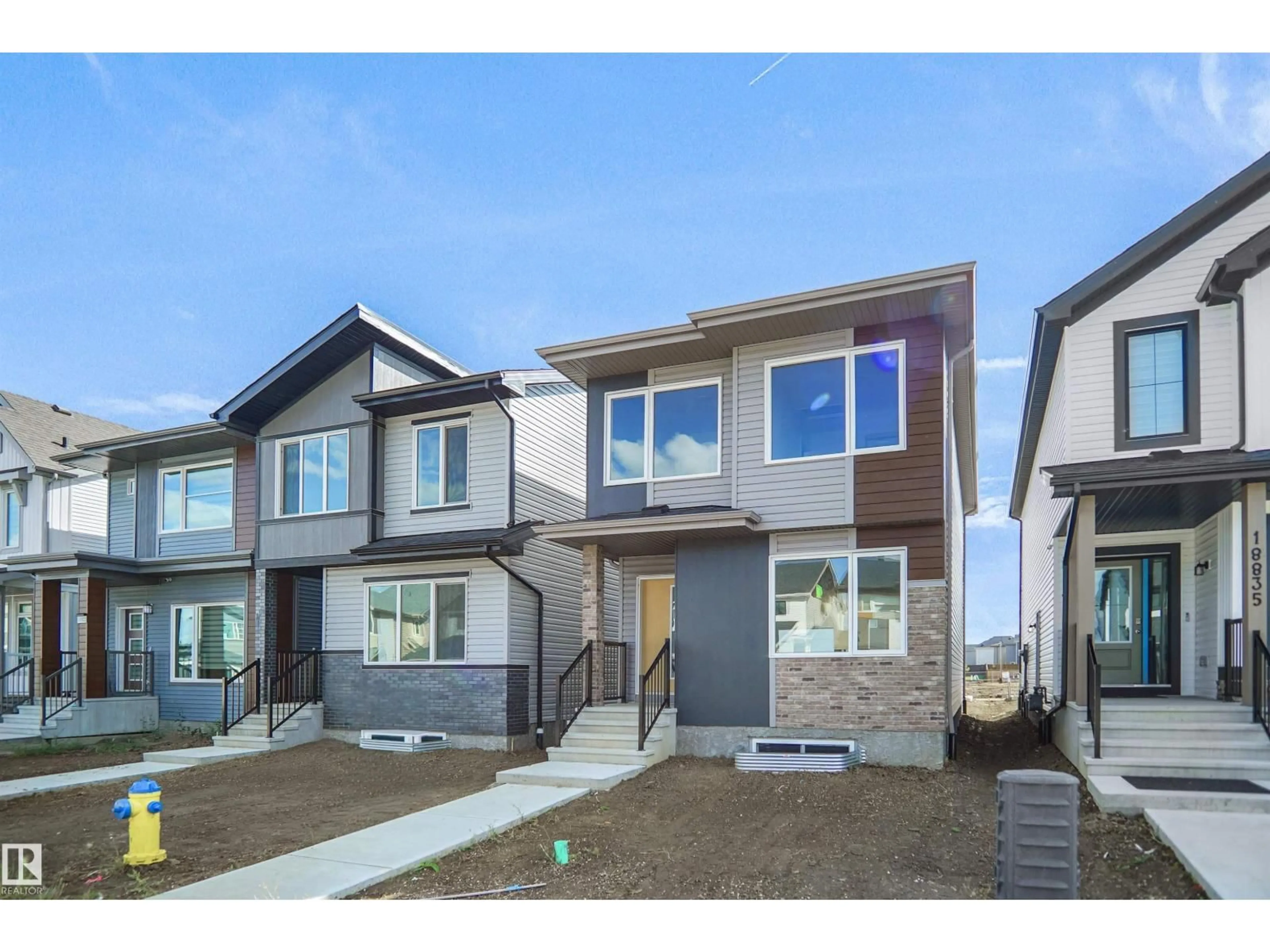 Home with vinyl exterior material, street for 20835 16 AV, Edmonton Alberta T6M3J5