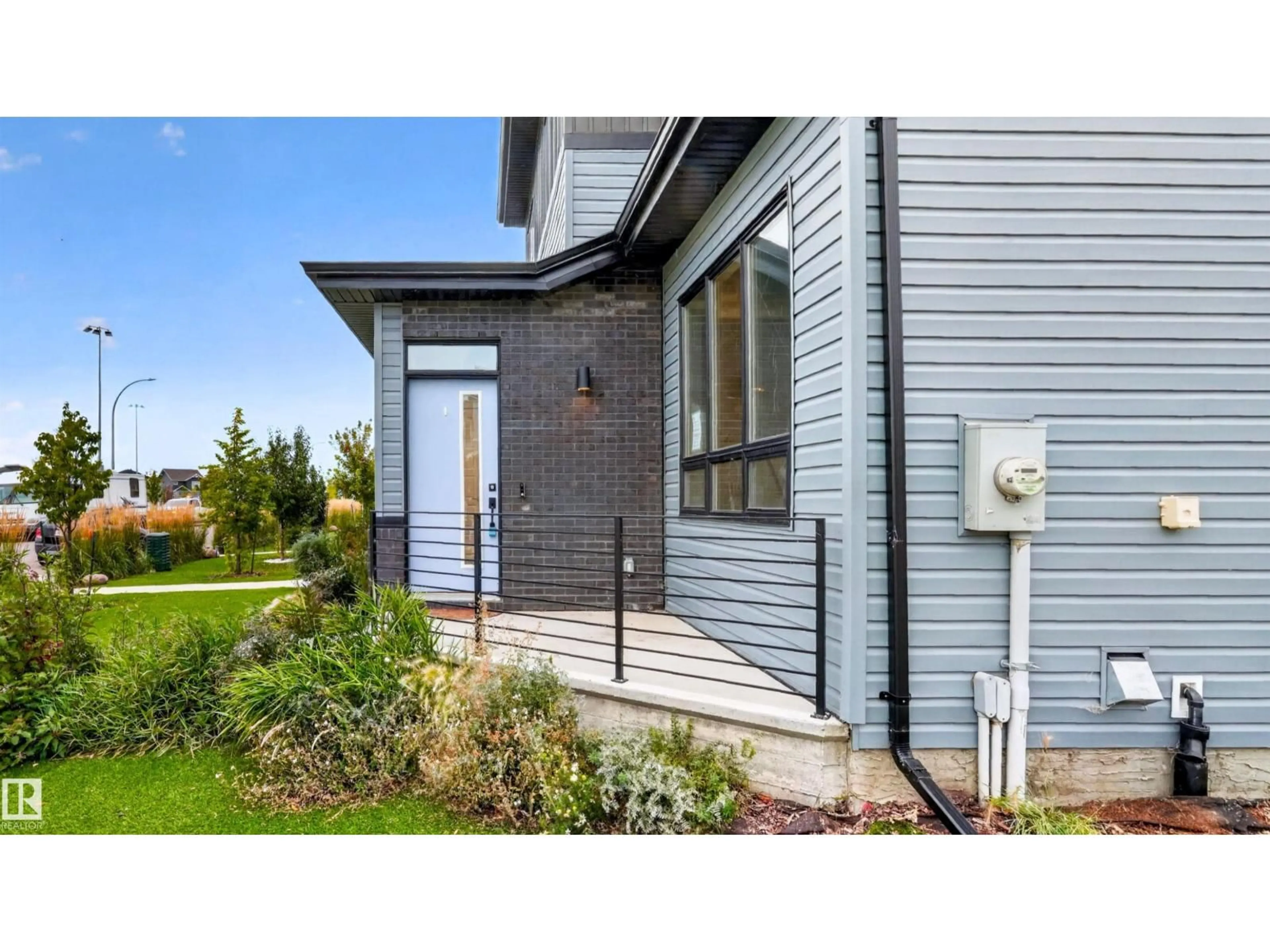 Home with vinyl exterior material, street for 105 GREENFIELD LI, Fort Saskatchewan Alberta T8L0X9