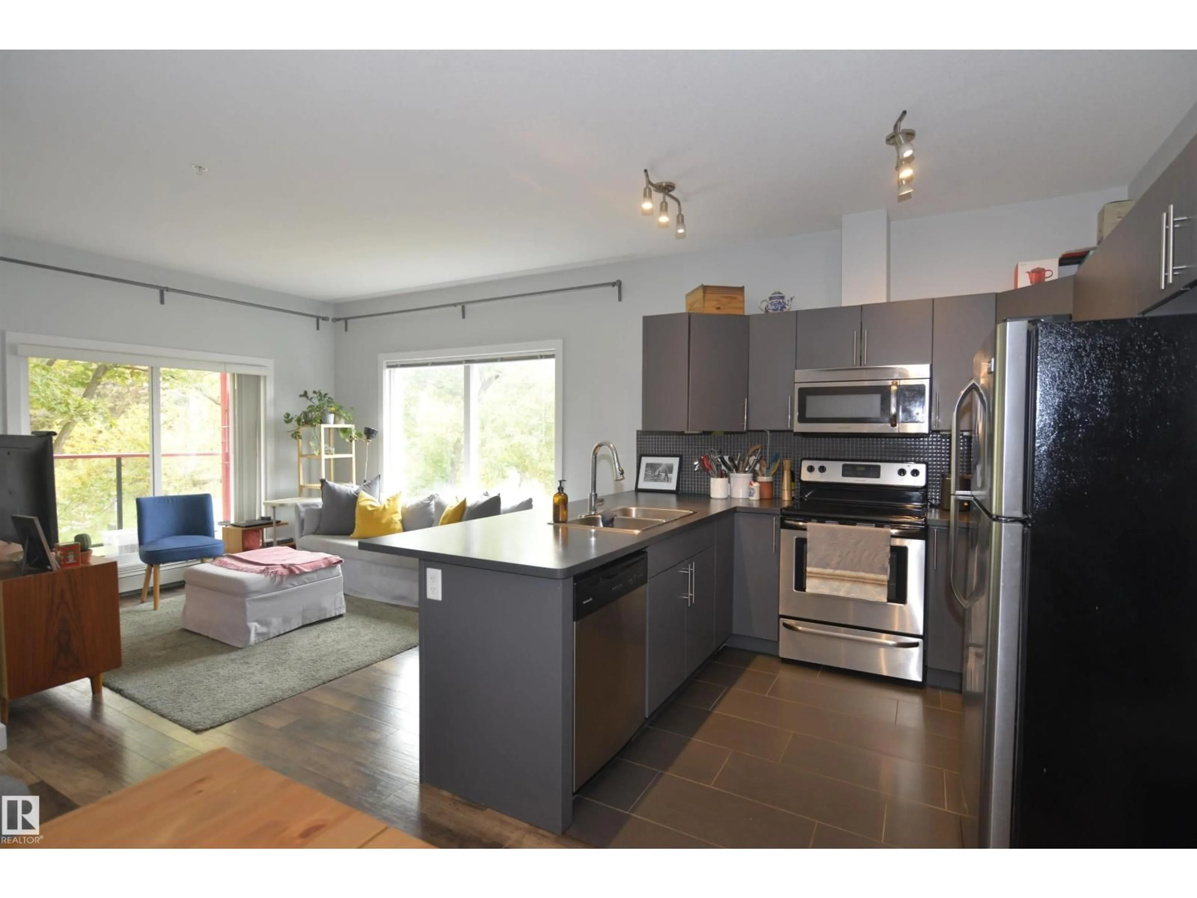 Open concept kitchen, wood/laminate floor for #304 - 10611 117 ST, Edmonton Alberta T5H0G6