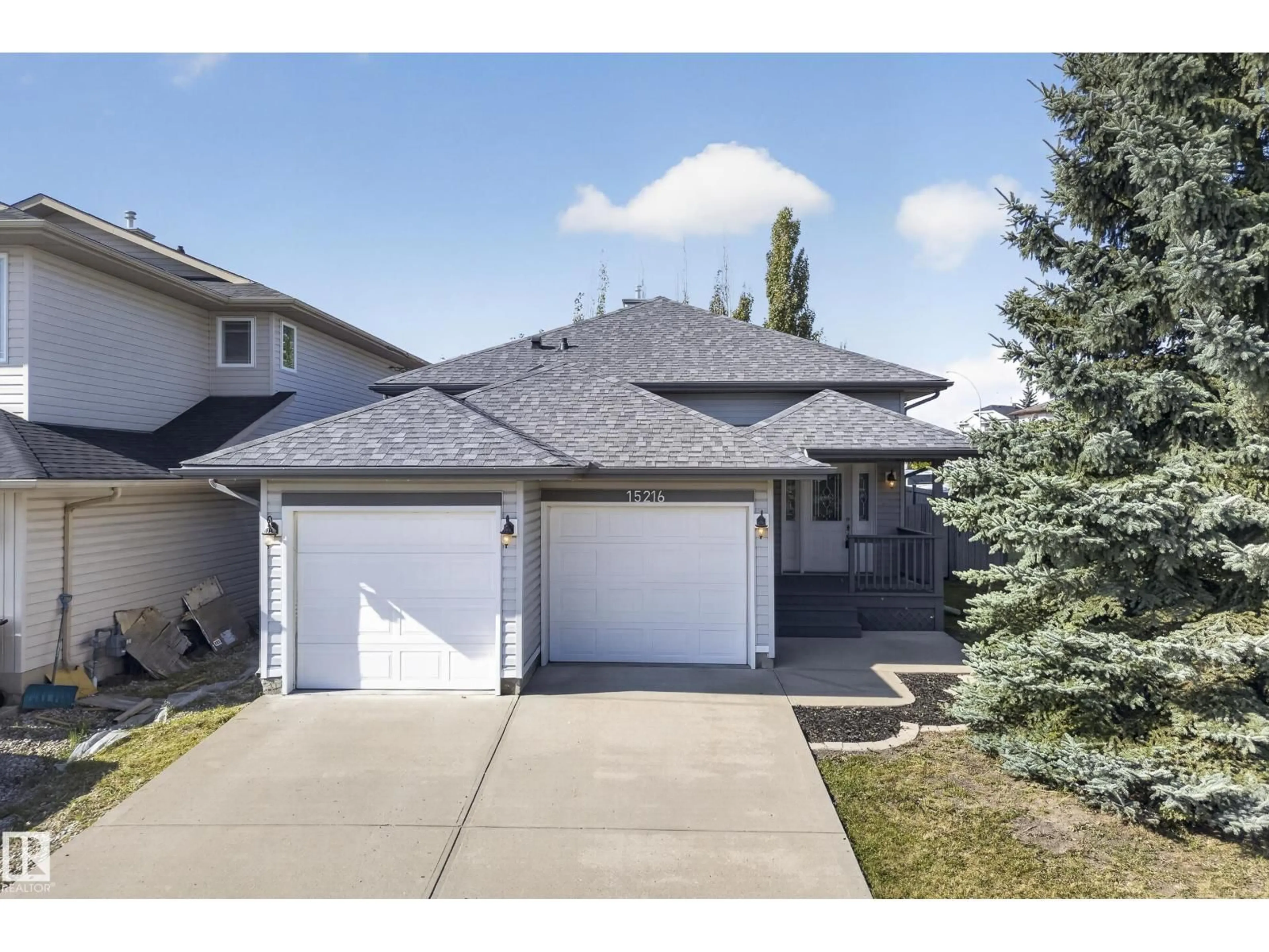 Home with vinyl exterior material, street for 15216 49 ST, Edmonton Alberta T5Y3C1