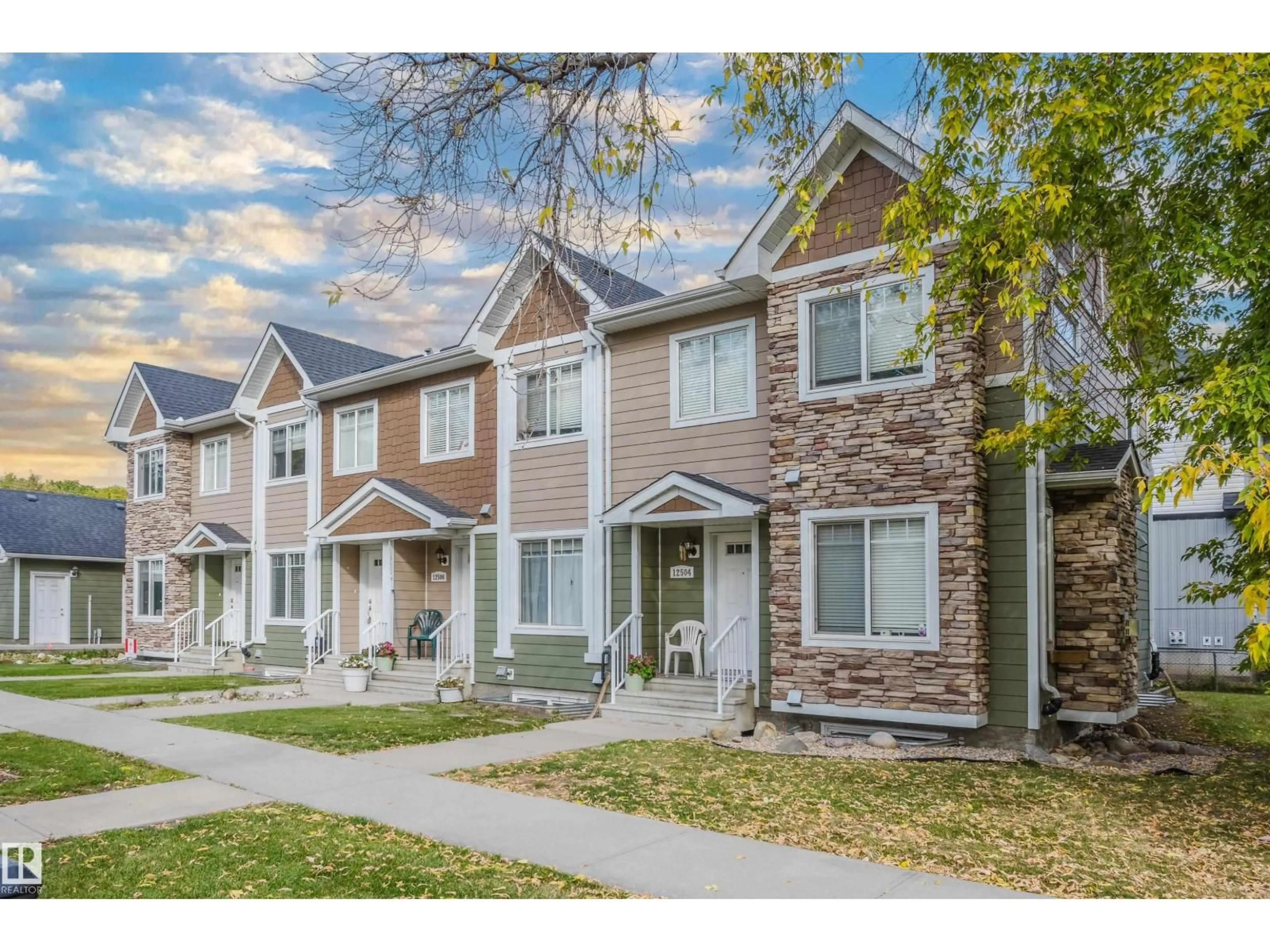 Home with vinyl exterior material, street for NW - 12504-12510 119 AV, Edmonton Alberta T5L2Z5