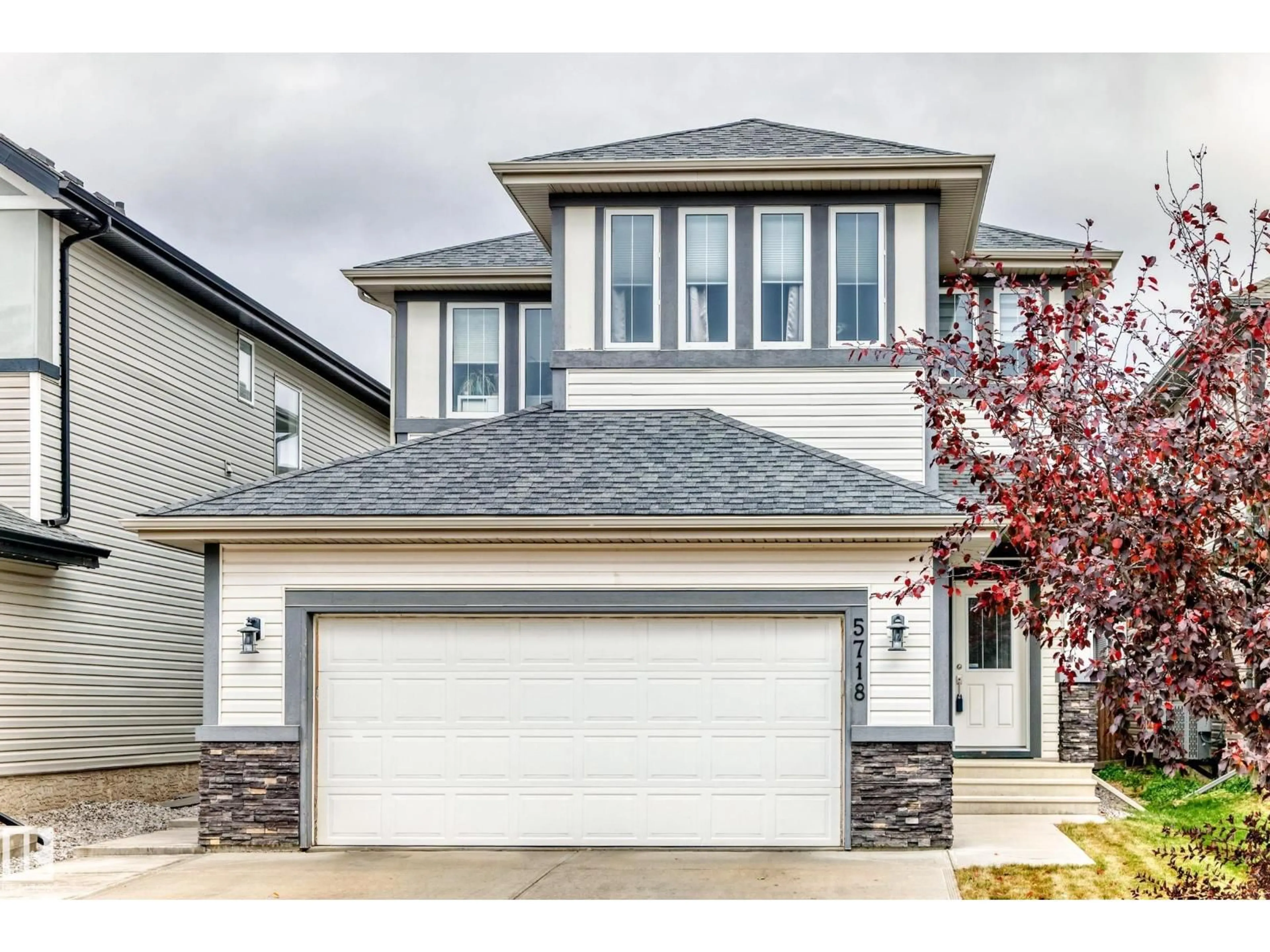 Home with vinyl exterior material, street for NW - 5718 175A AV, Edmonton Alberta T5Y0T7