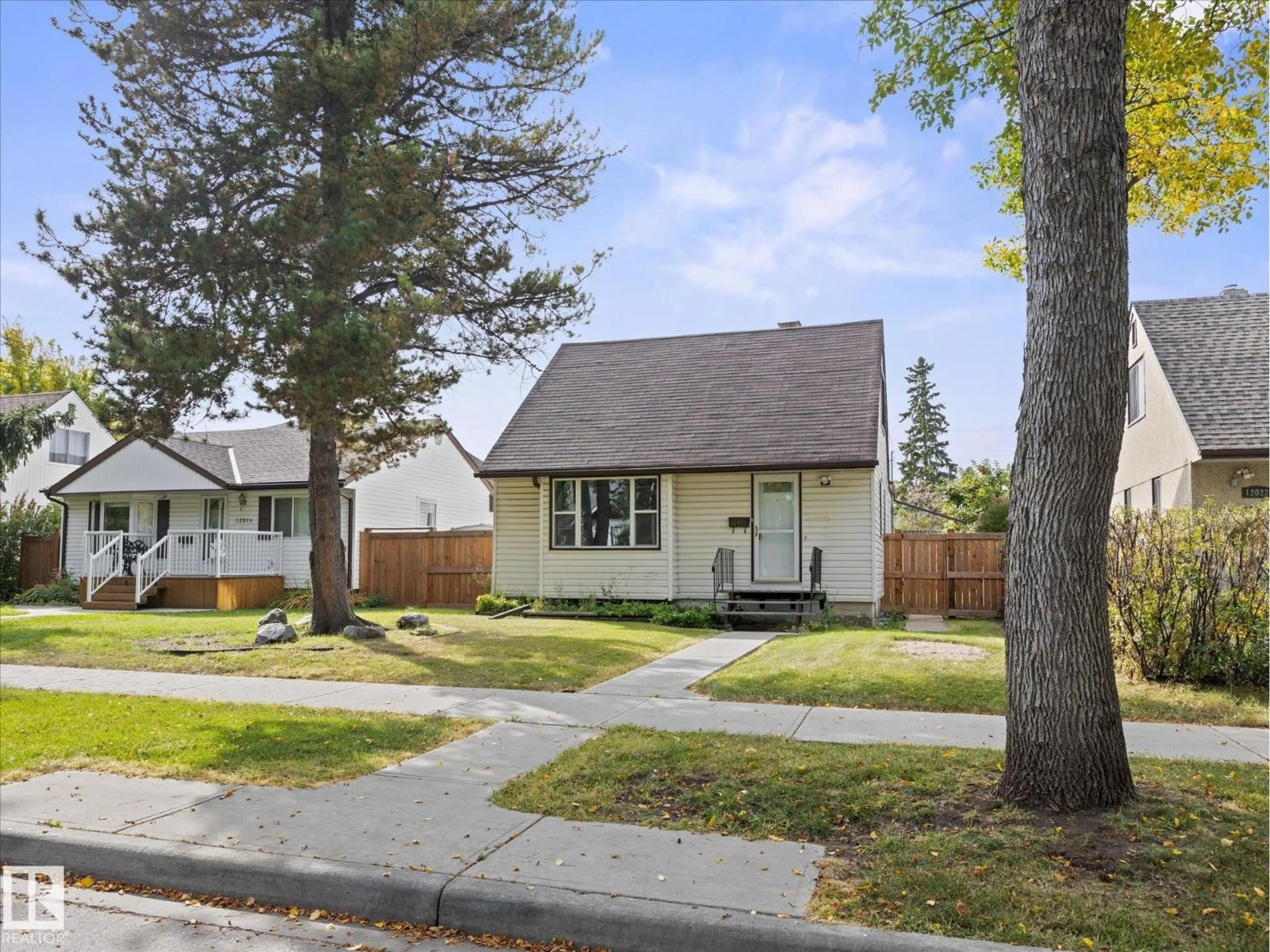 Home with vinyl exterior material, street for 12018 126 ST NW, Edmonton Alberta T5L0W5