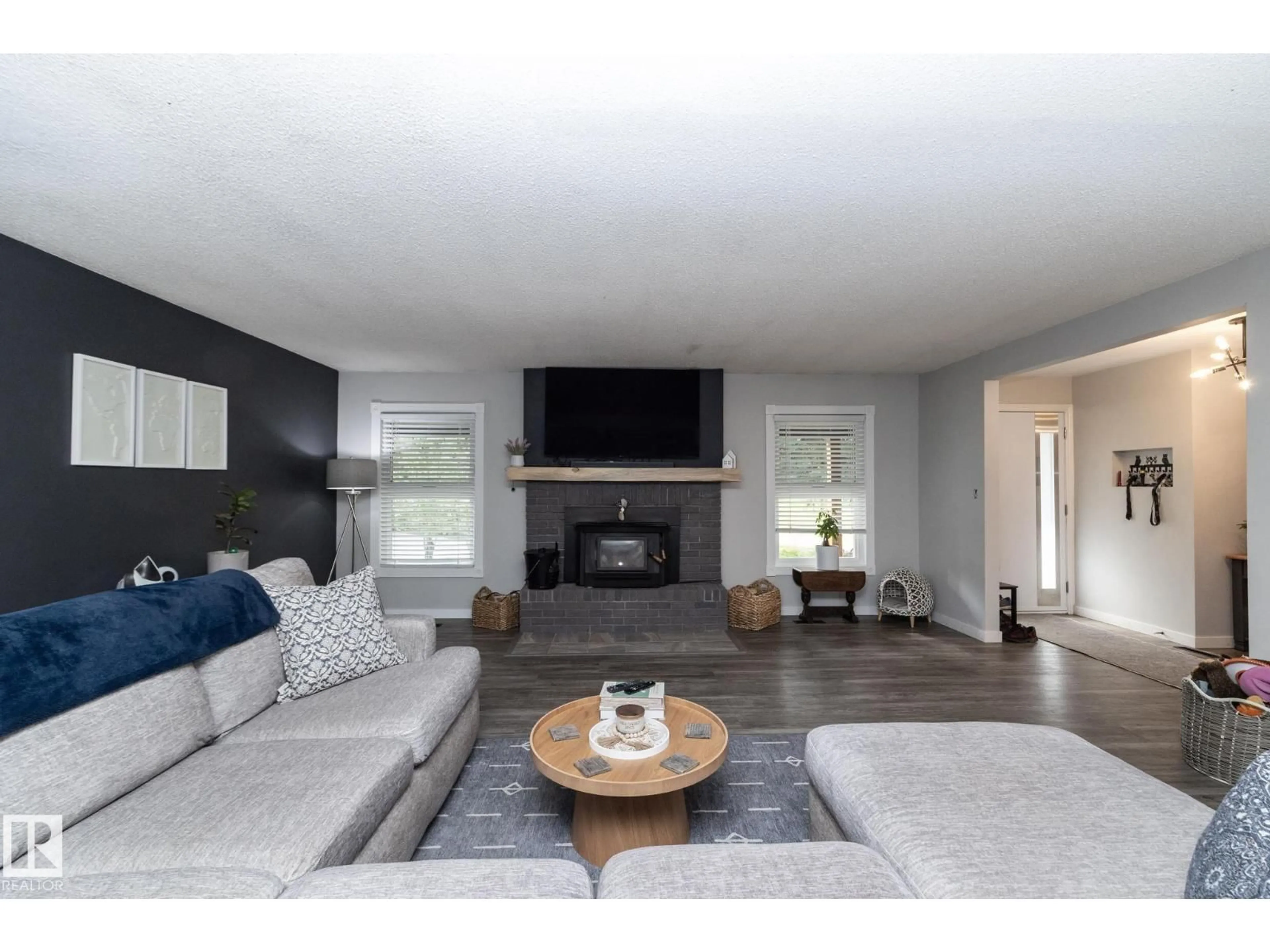 Living room with furniture, wood/laminate floor for #2 - 53111 RGE ROAD 21, Rural Parkland County Alberta T7X3X3