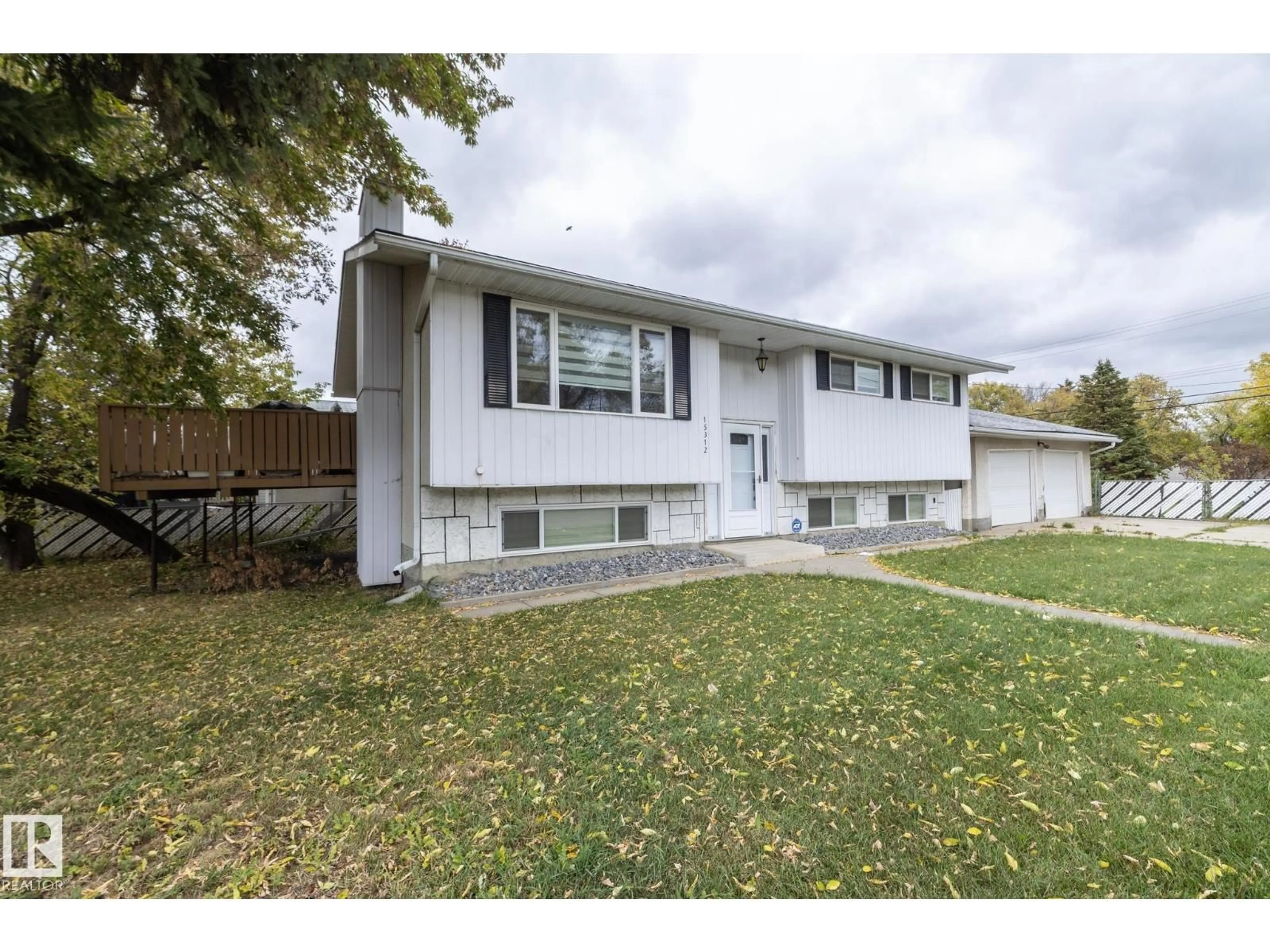 Home with vinyl exterior material, street for 15312 109 AV, Edmonton Alberta T5P4K7