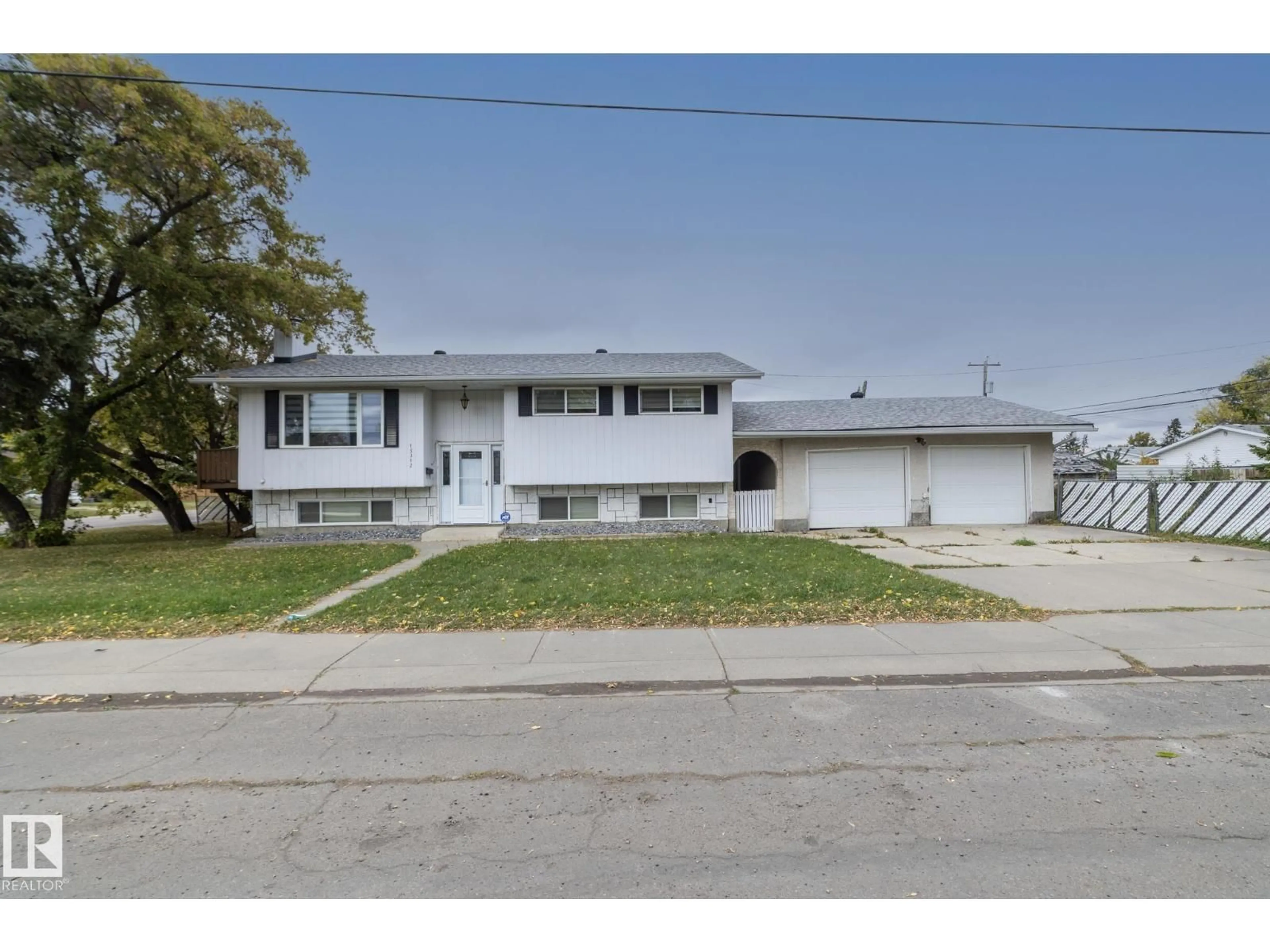 Home with vinyl exterior material, street for 15312 109 AV, Edmonton Alberta T5P4K7