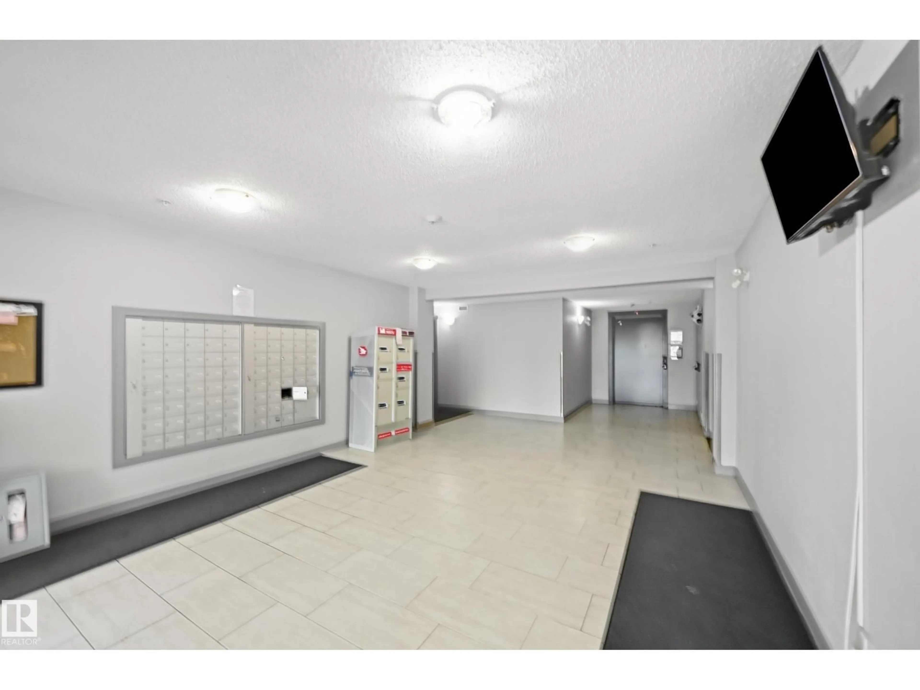 Indoor foyer for #215 - 11804 22 AV, Edmonton Alberta T6W2A2