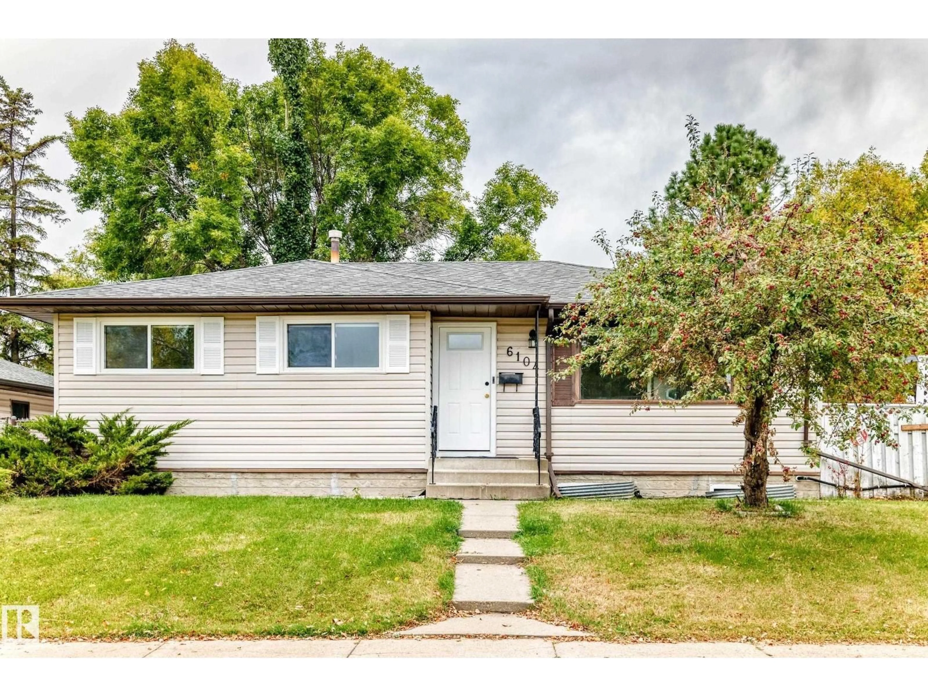 Home with vinyl exterior material, street for NW - 6104 149 AV, Edmonton Alberta T5A1V8