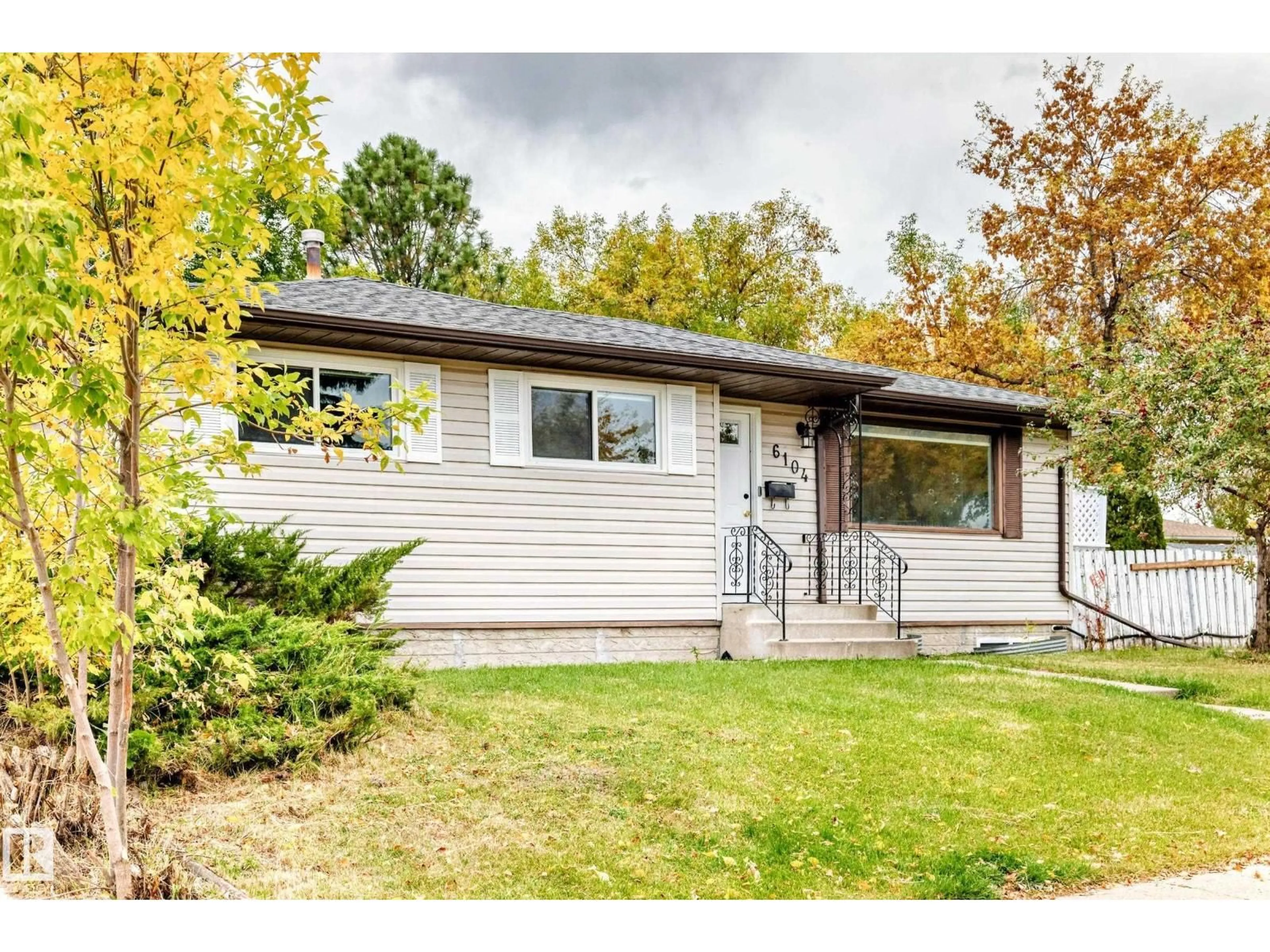 Home with vinyl exterior material, street for NW - 6104 149 AV, Edmonton Alberta T5A1V8