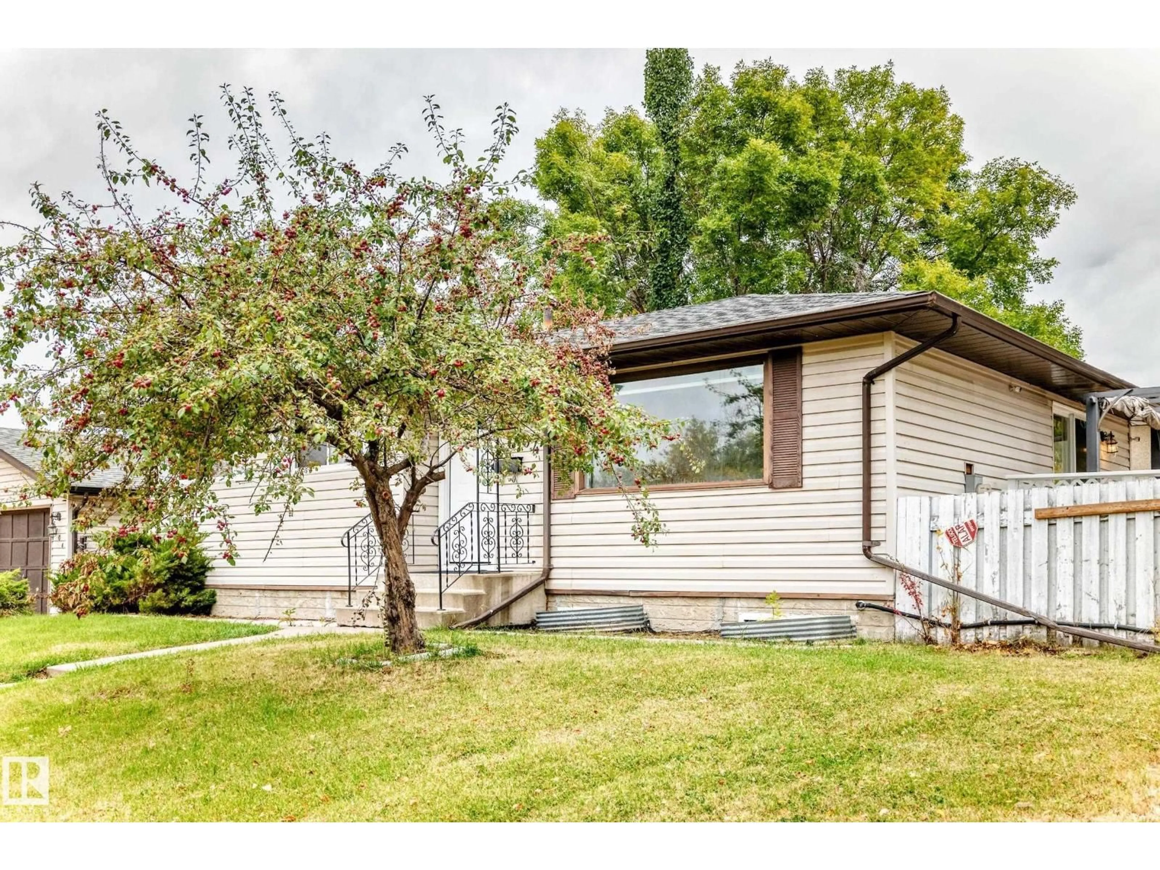 Home with vinyl exterior material, street for NW - 6104 149 AV, Edmonton Alberta T5A1V8