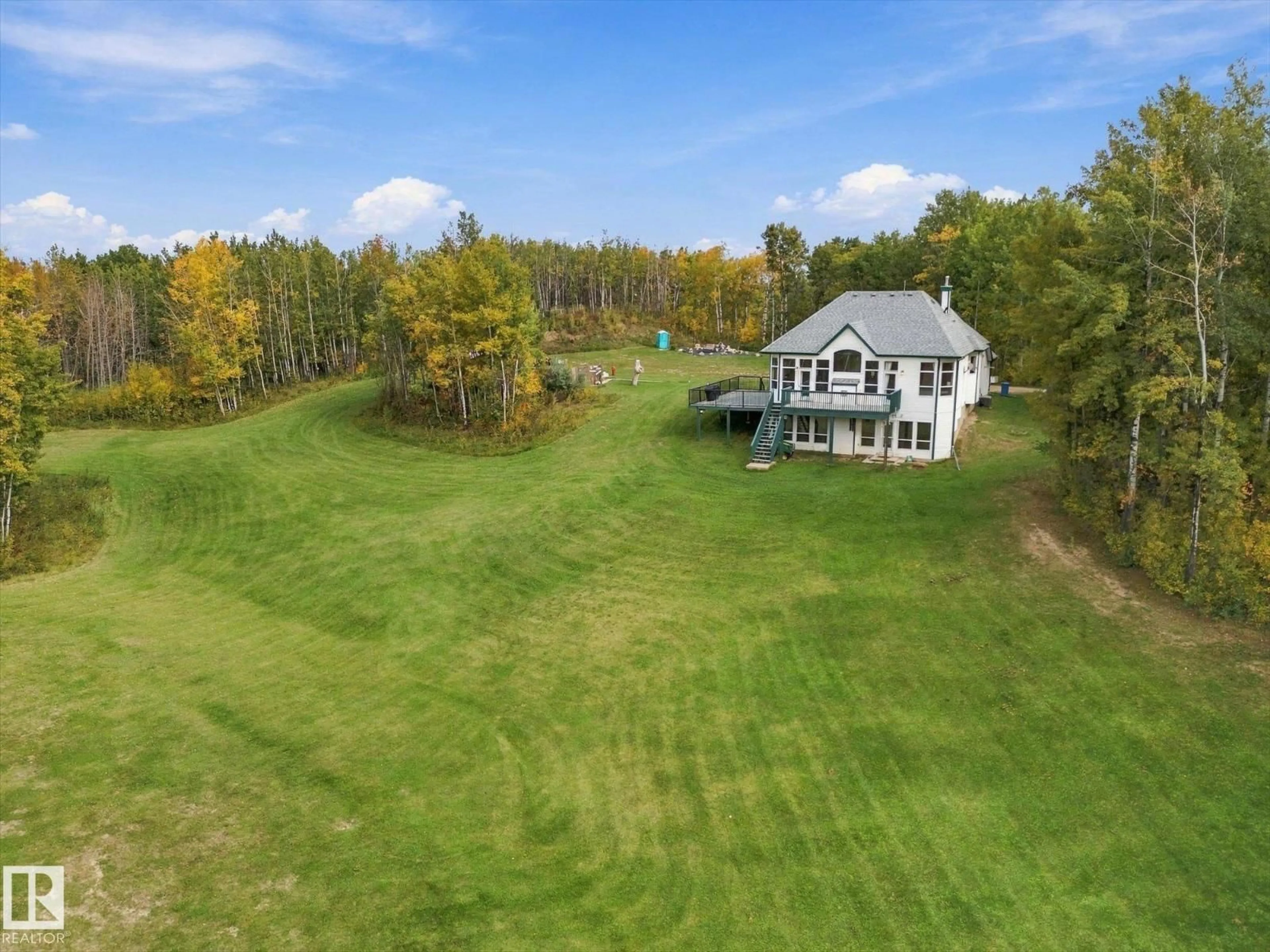 A pic from outside/outdoor area/front of a property/back of a property/a pic from drone, water/lake/river/ocean view for #7 - 54020 HGHWAY 779, Rural Parkland County Alberta T7Y0A3