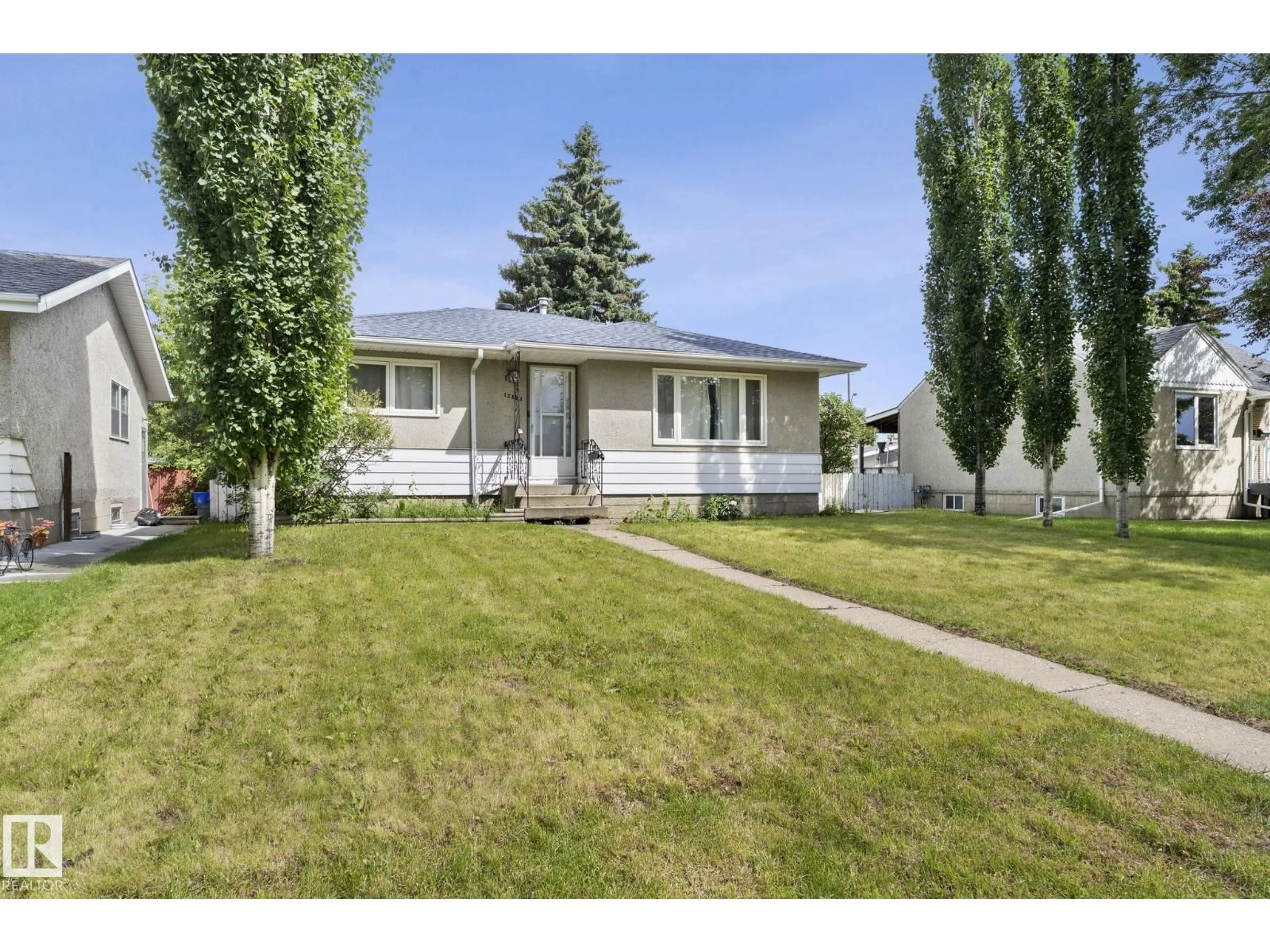 Home with vinyl exterior material, street for NW - 12823 88 ST, Edmonton Alberta T5E3H2