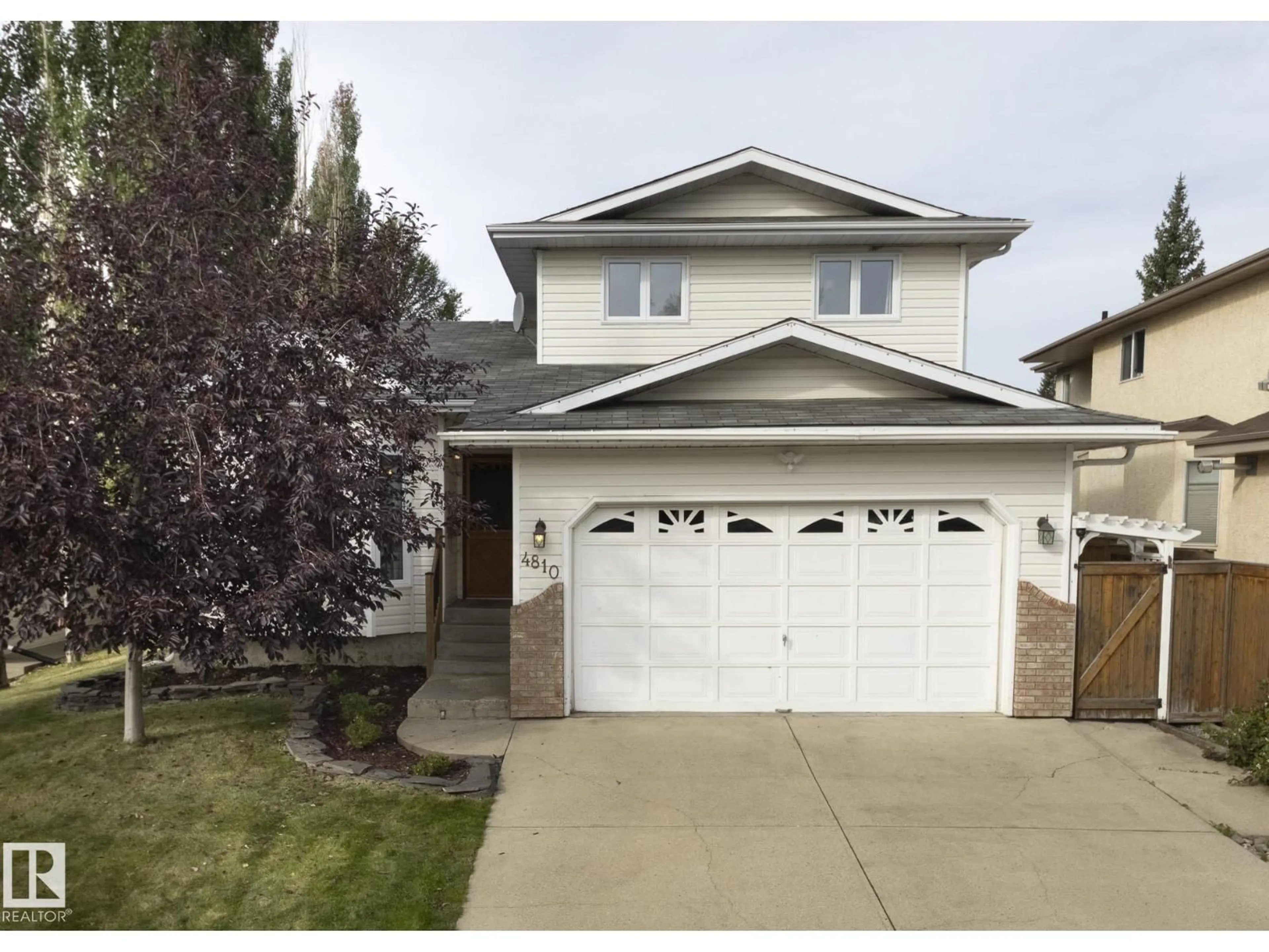 Home with vinyl exterior material, street for 4810 42 ST, Beaumont Alberta T4X1H2