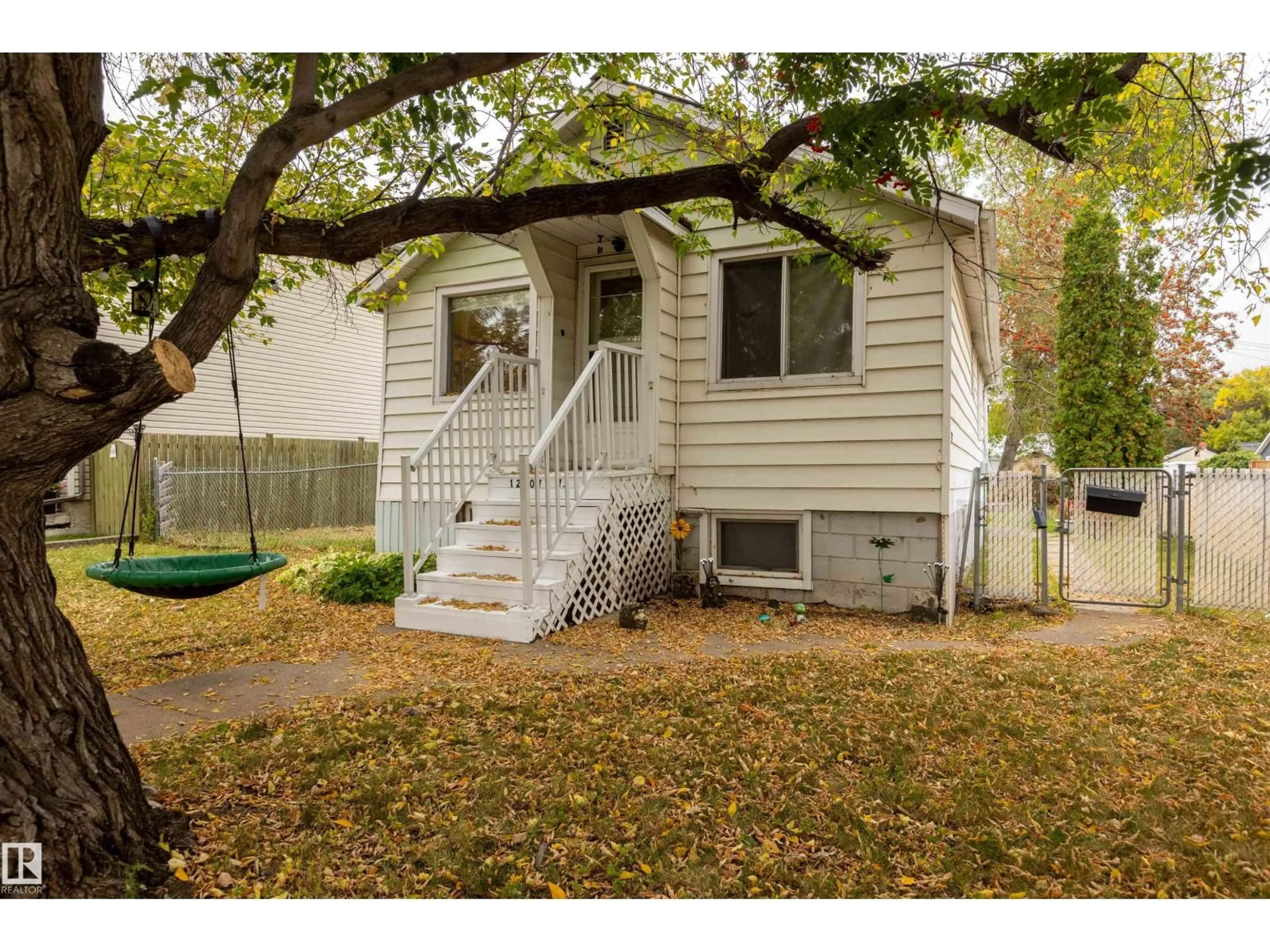 Home with vinyl exterior material, street for 12707 73 ST, Edmonton Alberta T5C0T1