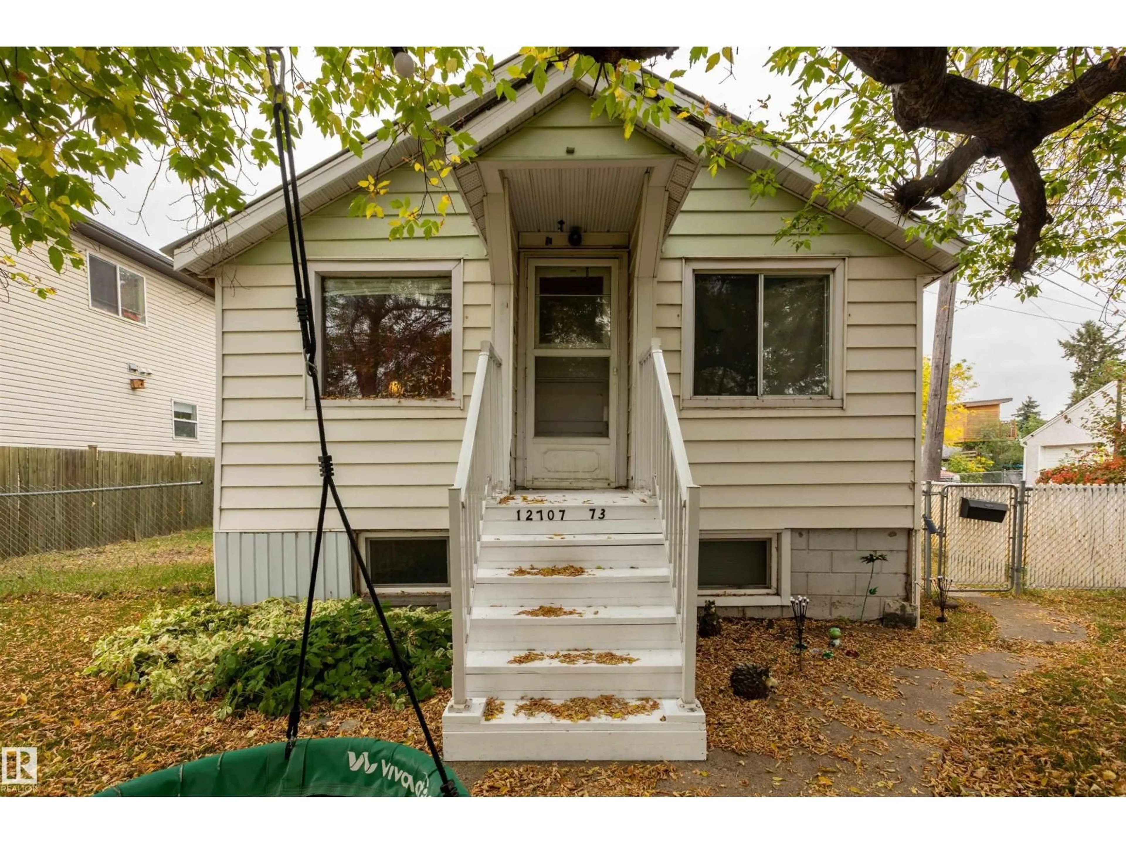 Home with vinyl exterior material, street for 12707 73 ST, Edmonton Alberta T5C0T1