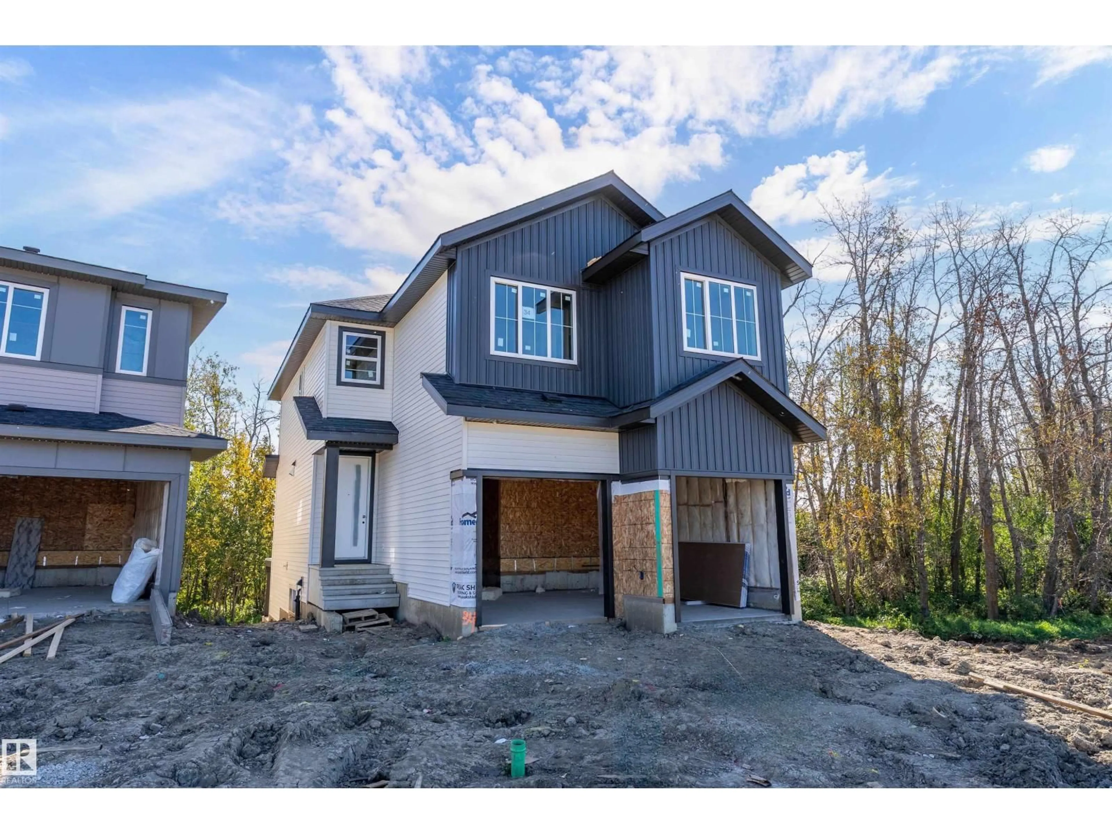Home with vinyl exterior material, street for 34 PEBBLE CV, Spruce Grove Alberta T7X4T1