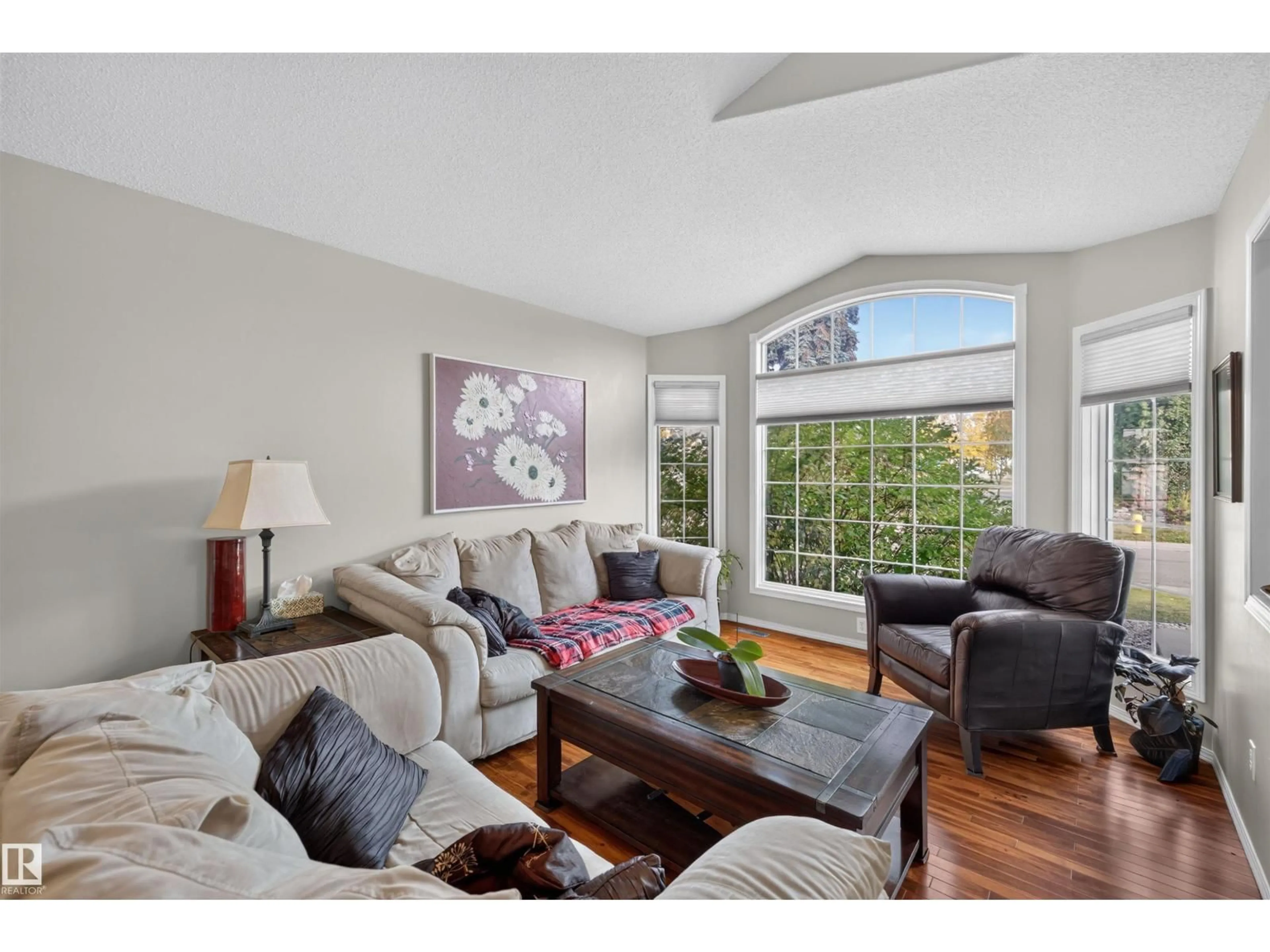 Living room with furniture, wood/laminate floor for 65 NOTTINGHAM BV, Sherwood Park Alberta T8A5P1