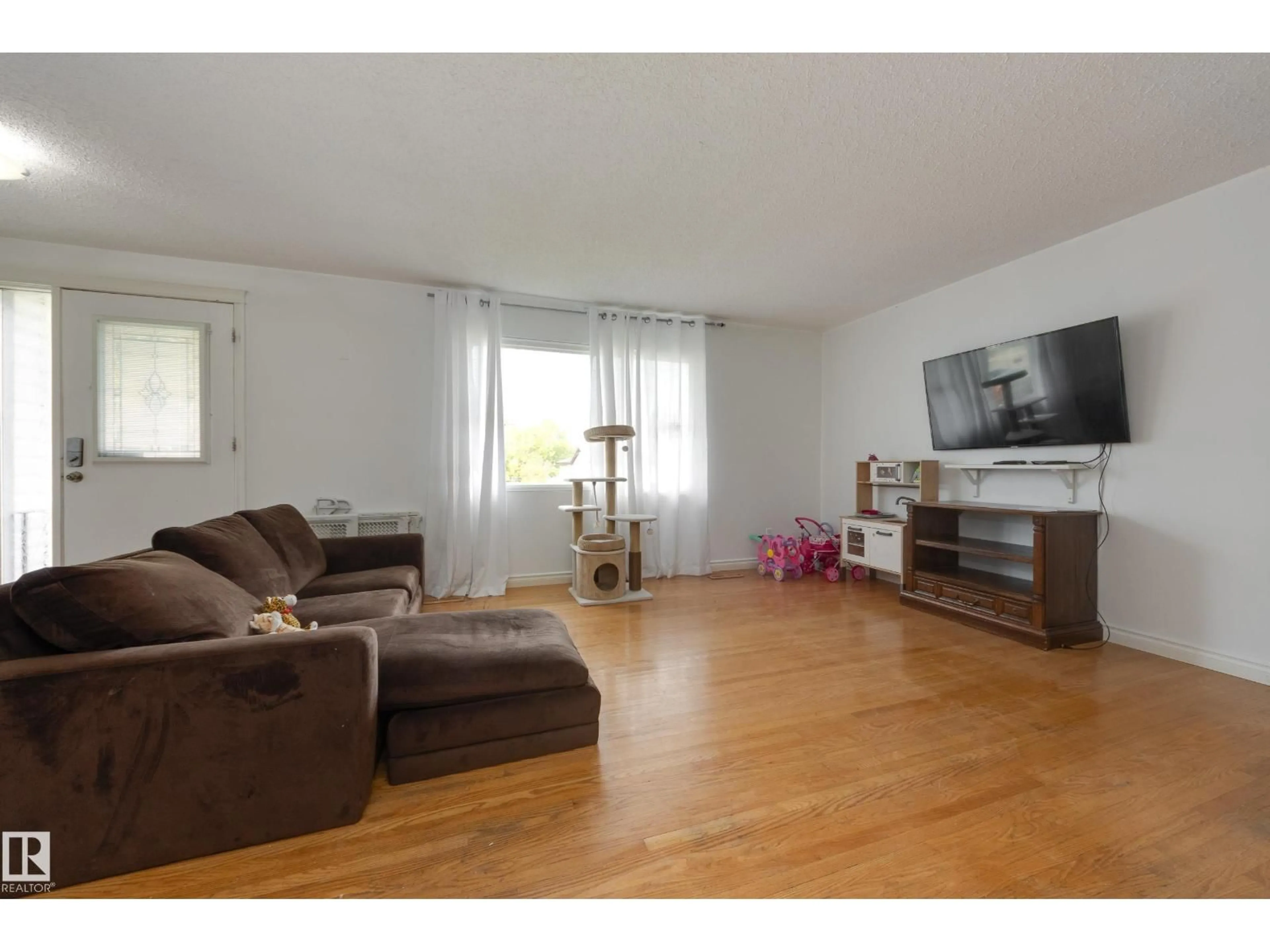 Living room with furniture, wood/laminate floor for 103 ACACIA CO, Sherwood Park Alberta T8A1K7