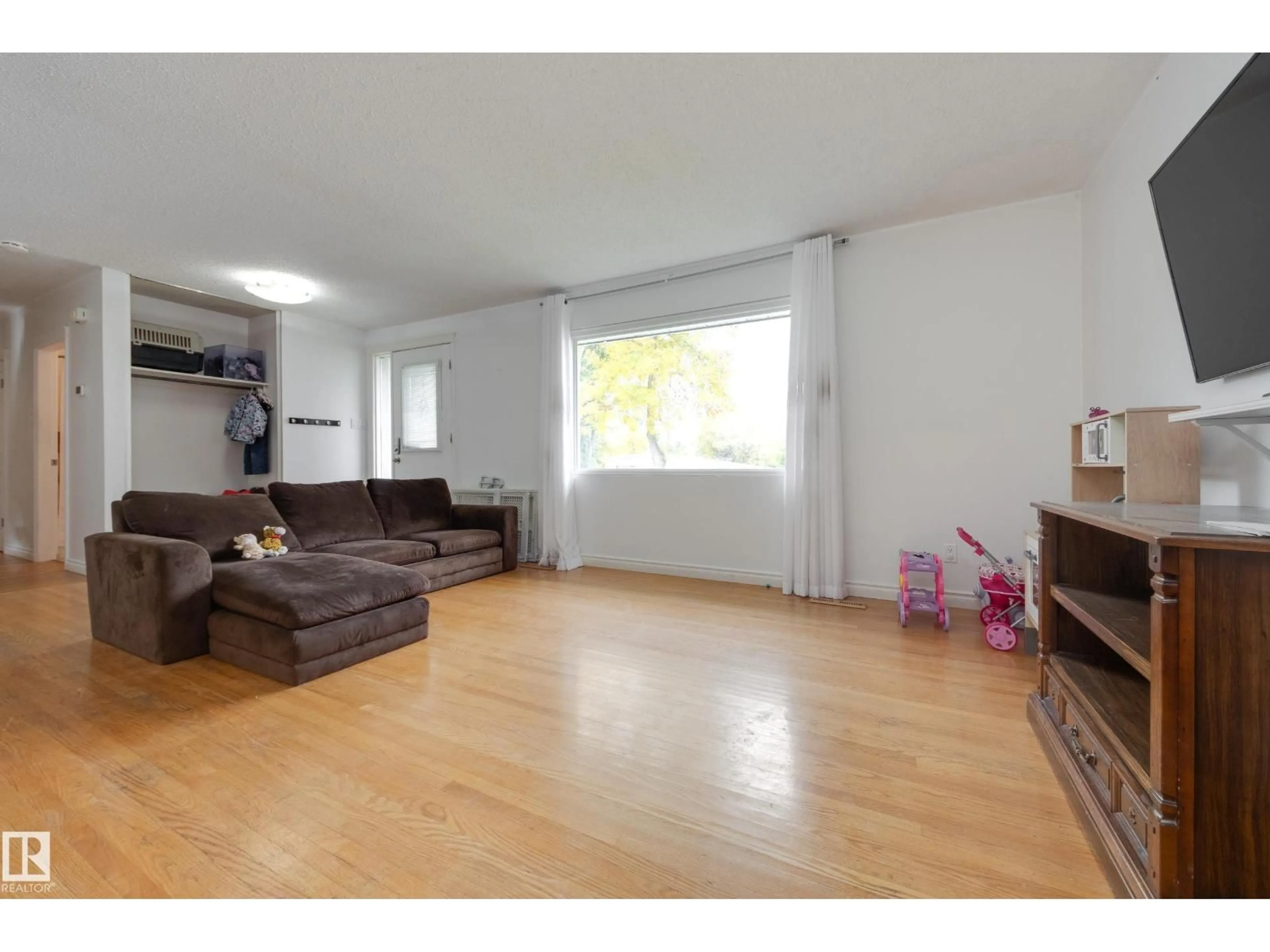 Living room with furniture, wood/laminate floor for 103 ACACIA CO, Sherwood Park Alberta T8A1K7