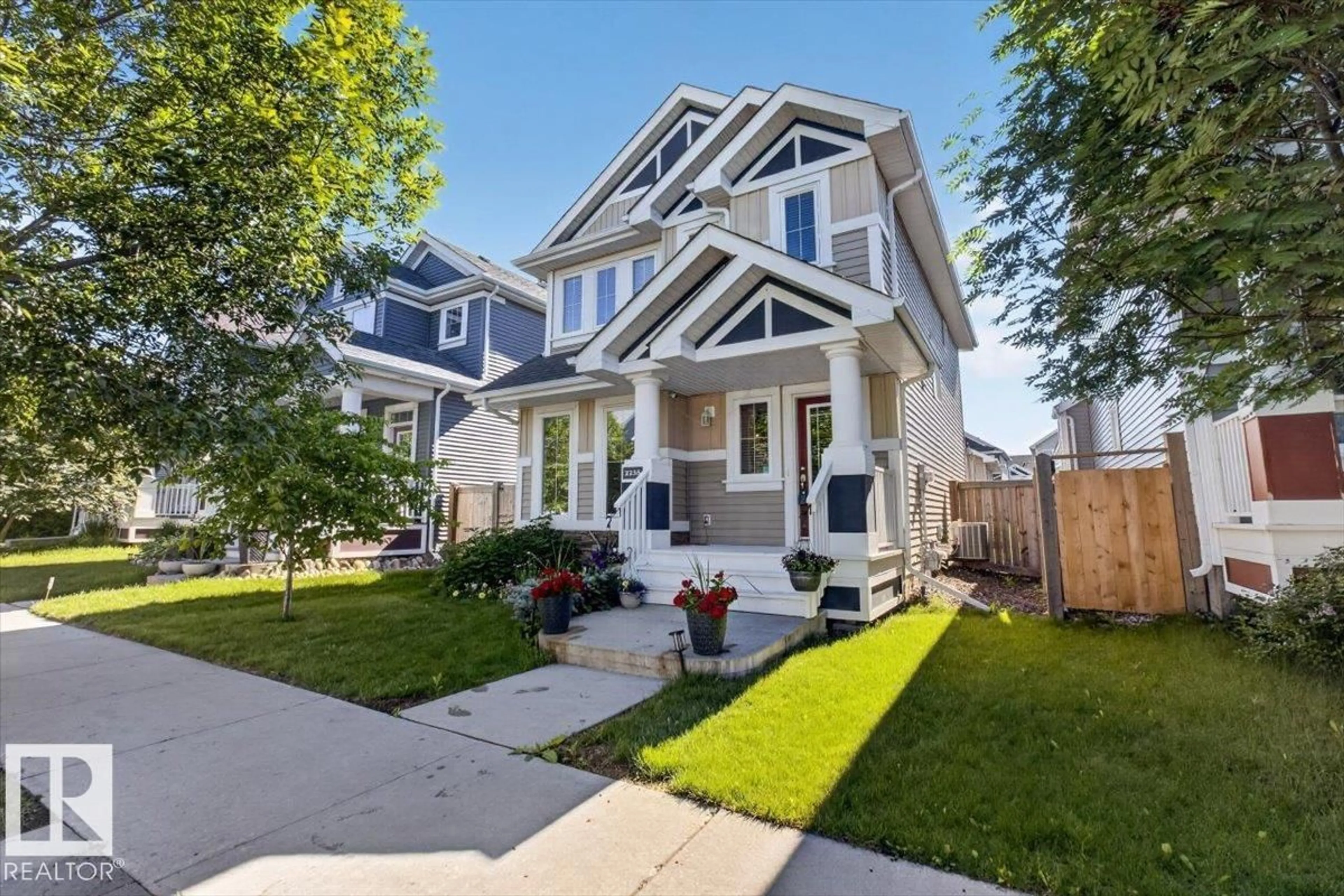 Home with vinyl exterior material, street for 2235 76 ST, Edmonton Alberta T6X0Z3