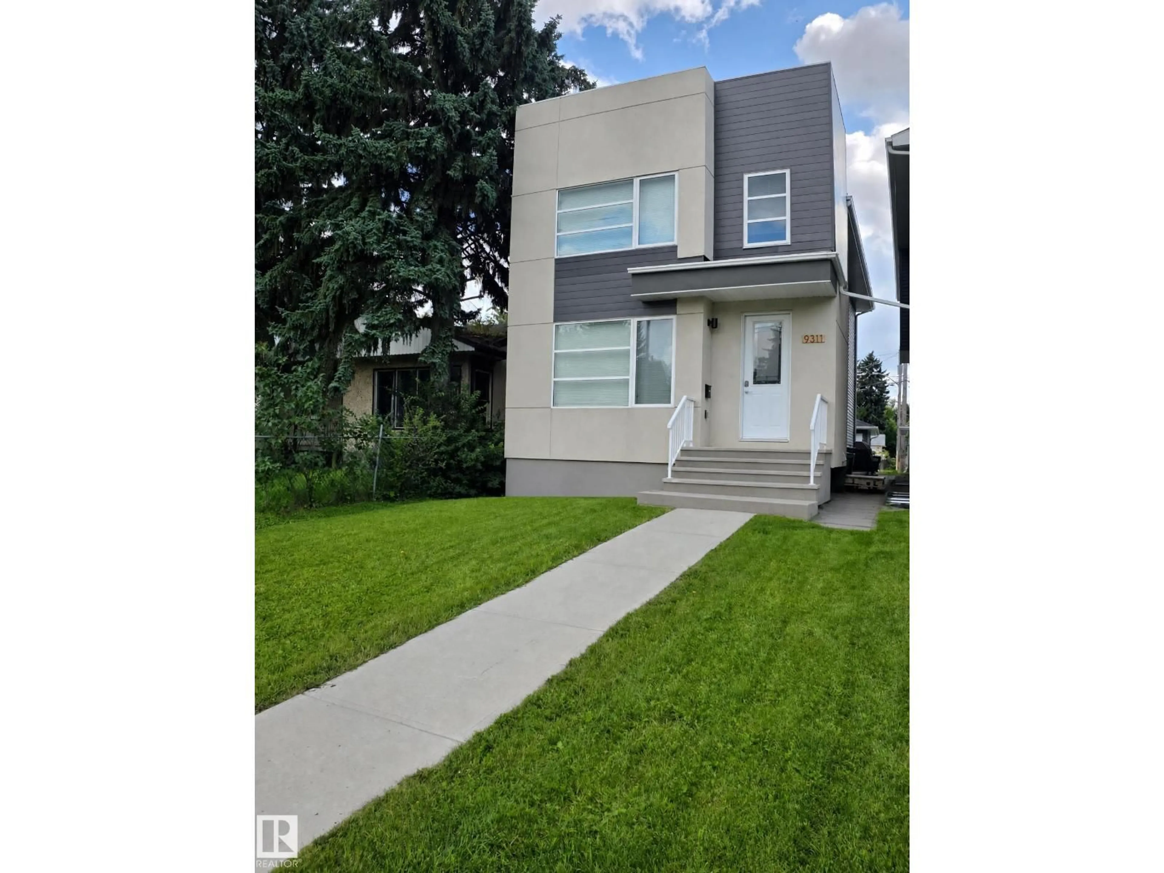 Home with vinyl exterior material, street for 9311 66 AV, Edmonton Alberta T6E0L8