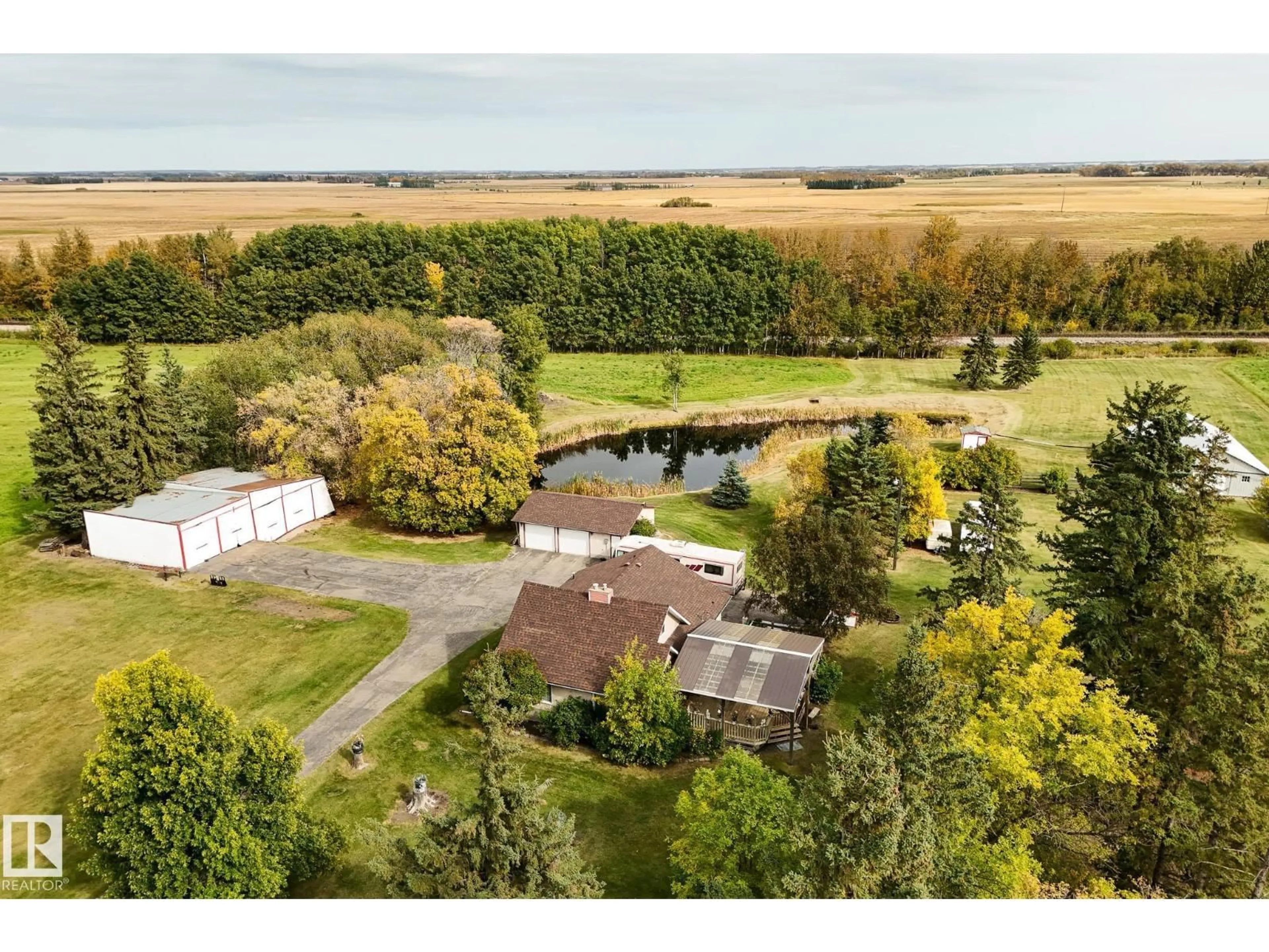 A pic from outside/outdoor area/front of a property/back of a property/a pic from drone, water/lake/river/ocean view for 464025 RGE ROAD 242, Rural Wetaskiwin County Alberta T9A1W8
