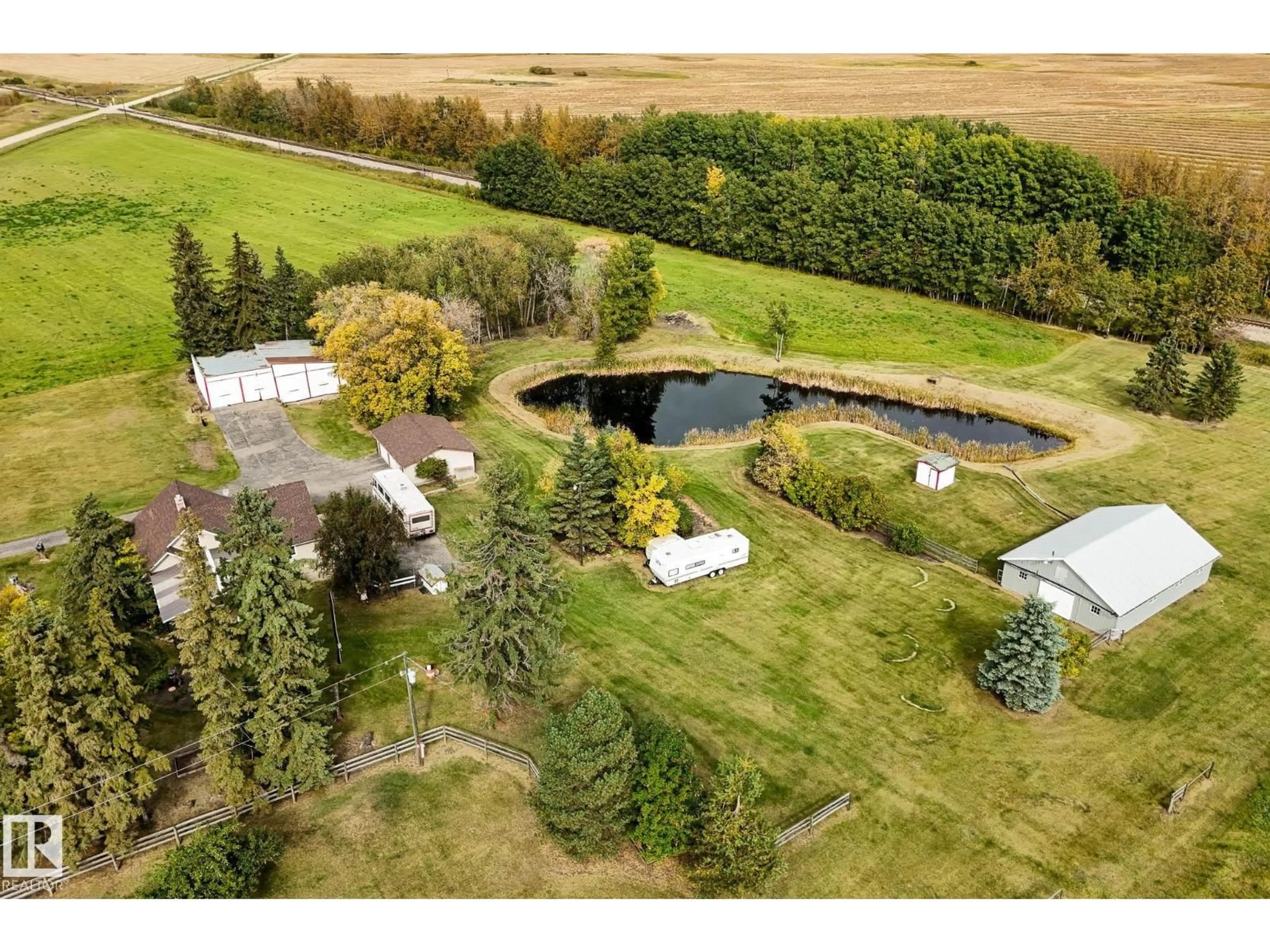 A pic from outside/outdoor area/front of a property/back of a property/a pic from drone, water/lake/river/ocean view for 464025 RGE ROAD 242, Rural Wetaskiwin County Alberta T9A1W8