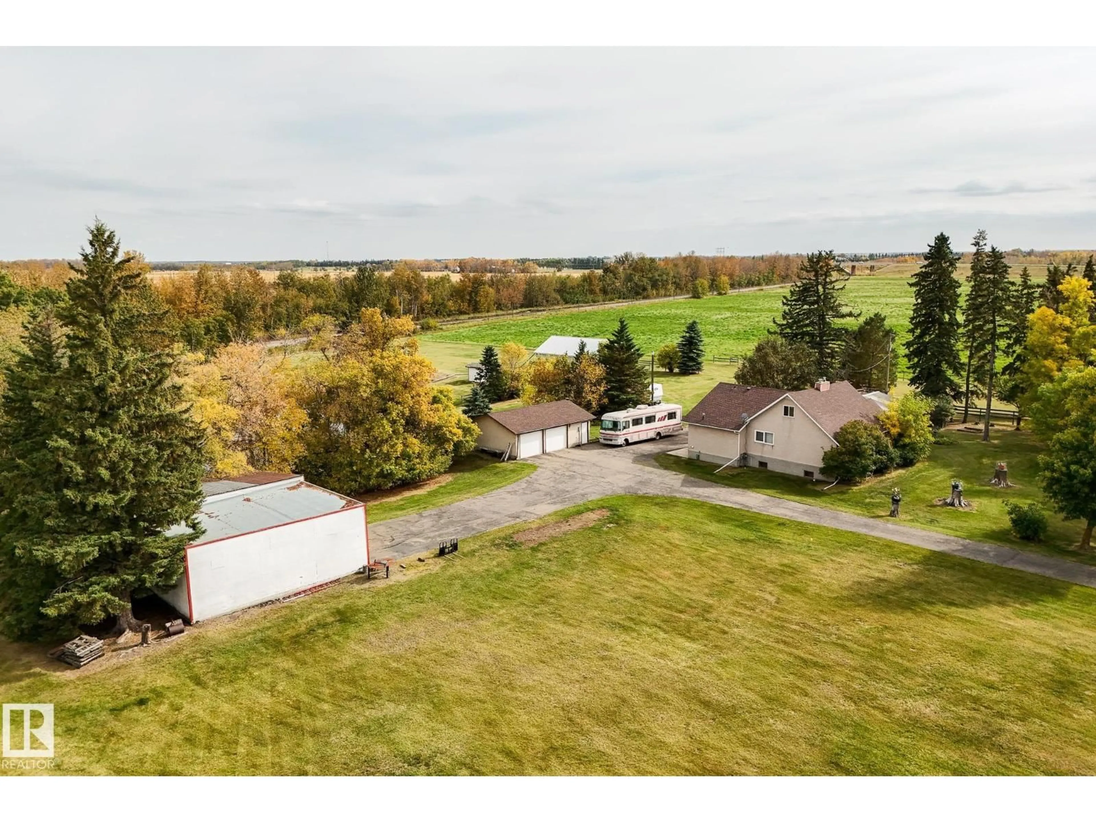 A pic from outside/outdoor area/front of a property/back of a property/a pic from drone, water/lake/river/ocean view for 464025 RGE ROAD 242, Rural Wetaskiwin County Alberta T9A1W8