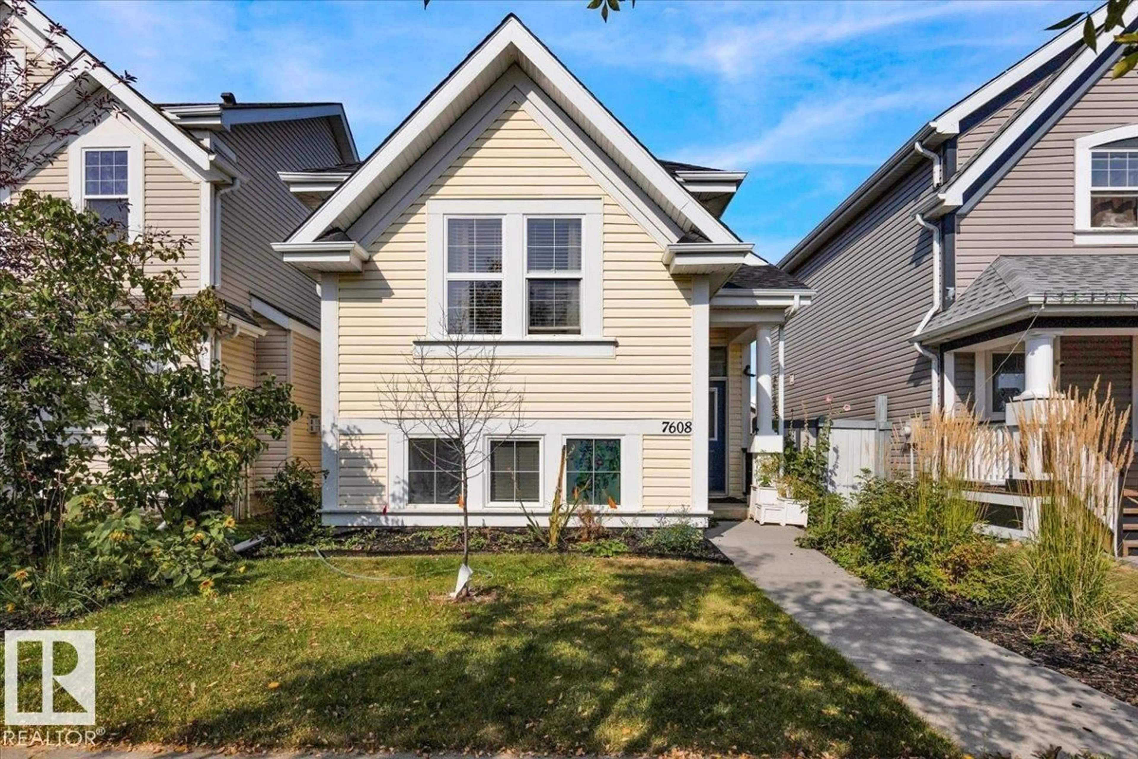 Home with vinyl exterior material, street for 7608 15 AV, Edmonton Alberta T6X1M1