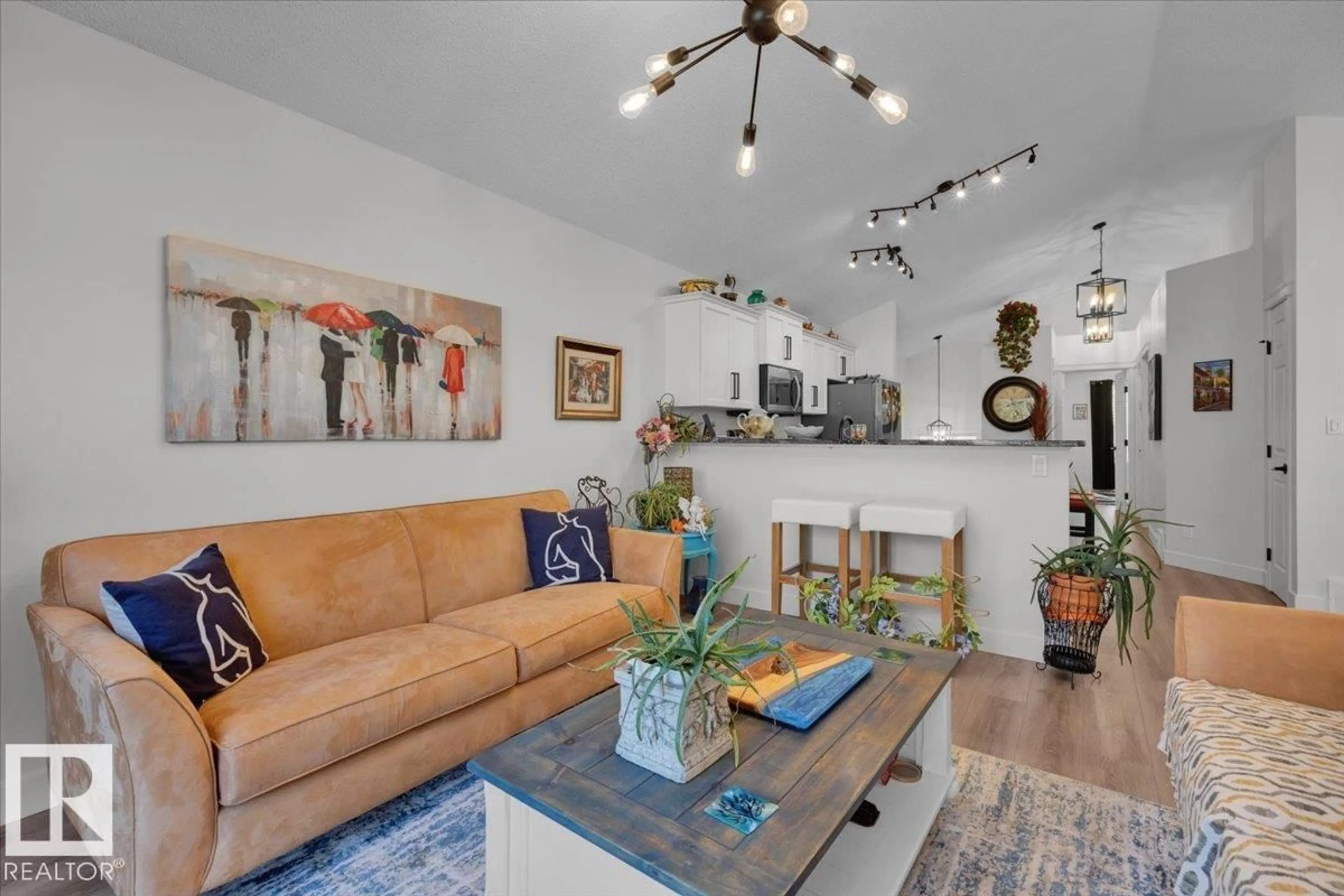 Living room with furniture, ceramic/tile floor for 7608 15 AV, Edmonton Alberta T6X1M1