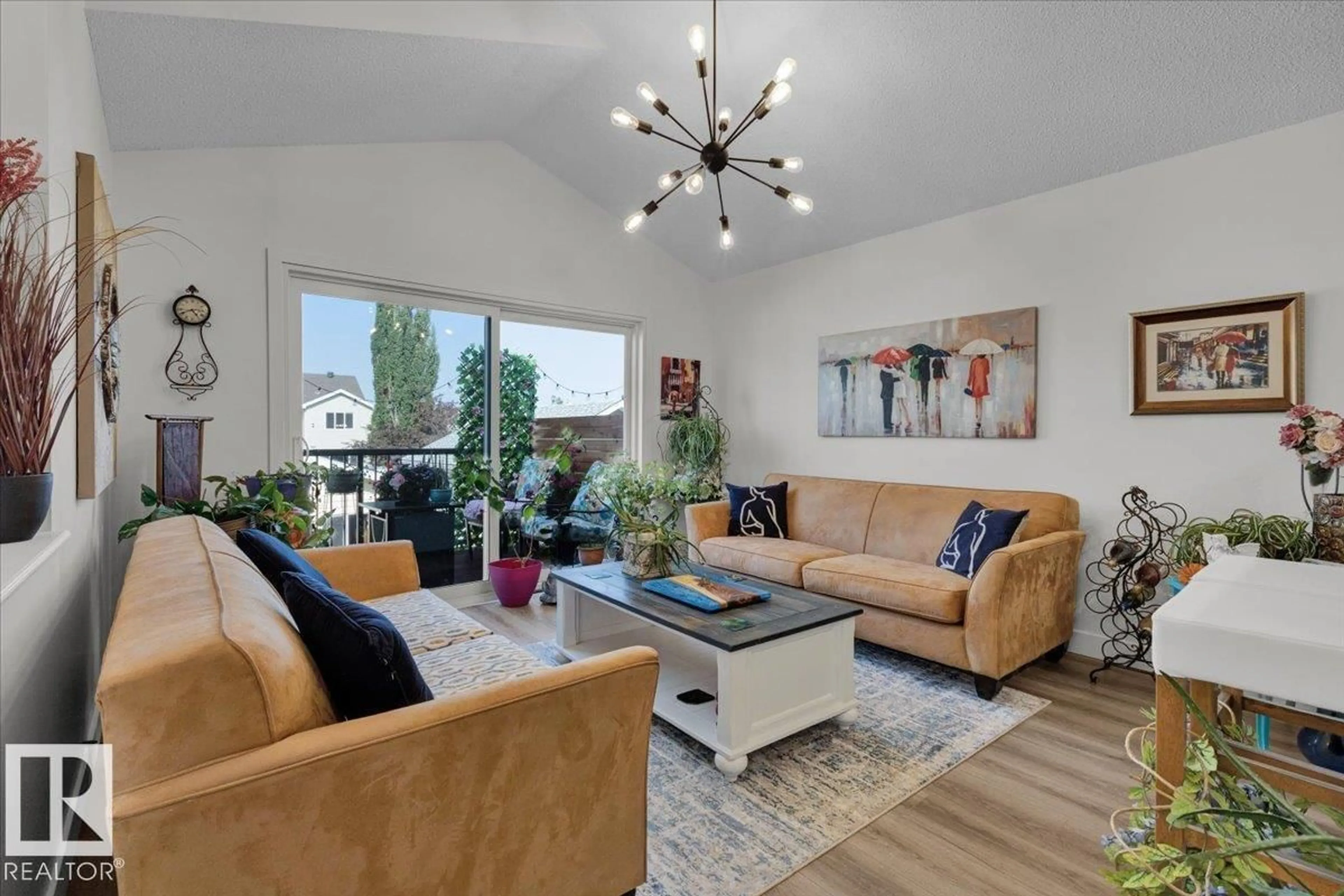 Living room with furniture, wood/laminate floor for 7608 15 AV, Edmonton Alberta T6X1M1
