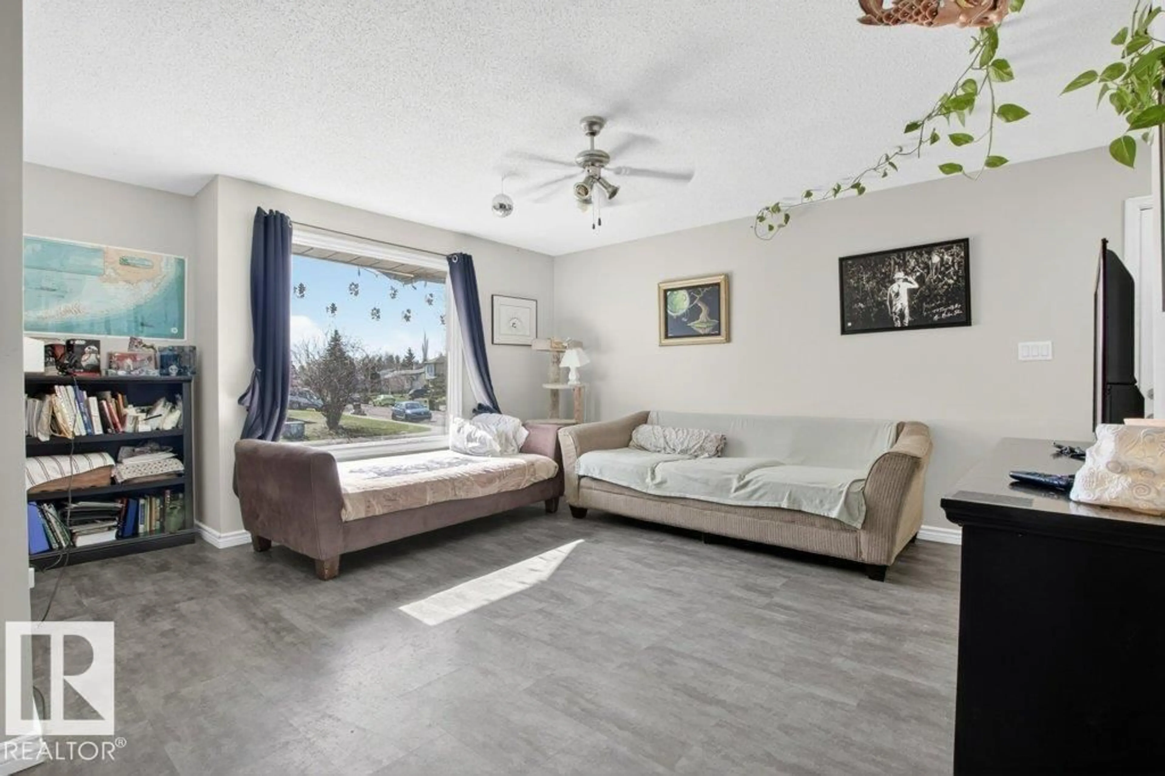 Living room with furniture, unknown for NW - 2104 145 AV, Edmonton Alberta T5Y1T9