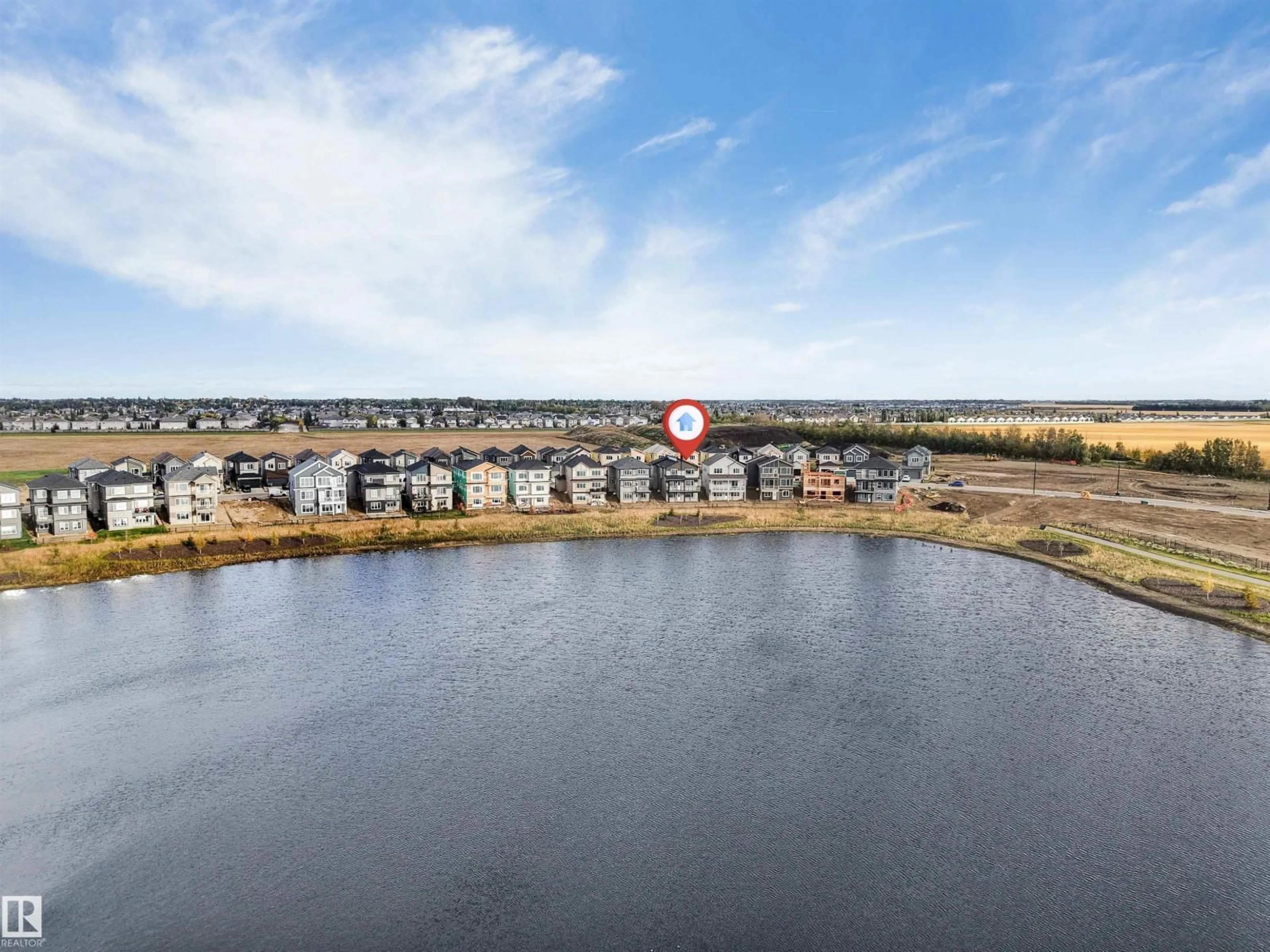 A pic from outside/outdoor area/front of a property/back of a property/a pic from drone, water/lake/river/ocean view for 229 CRYSTAL CREEK DR, Leduc Alberta T9E0X6