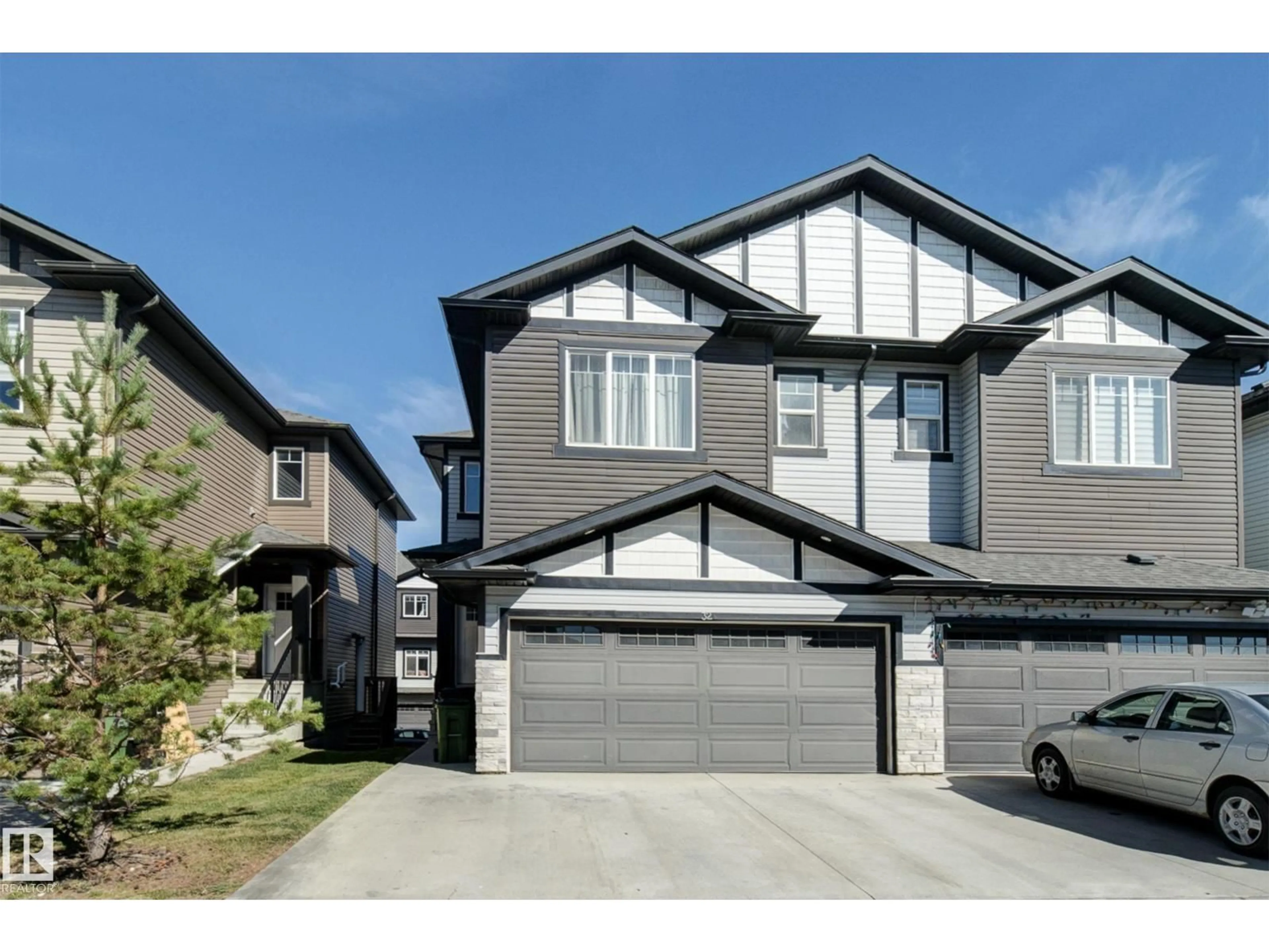 Home with vinyl exterior material, street for 32 - 1703 16 AV, Edmonton Alberta T6T2C3