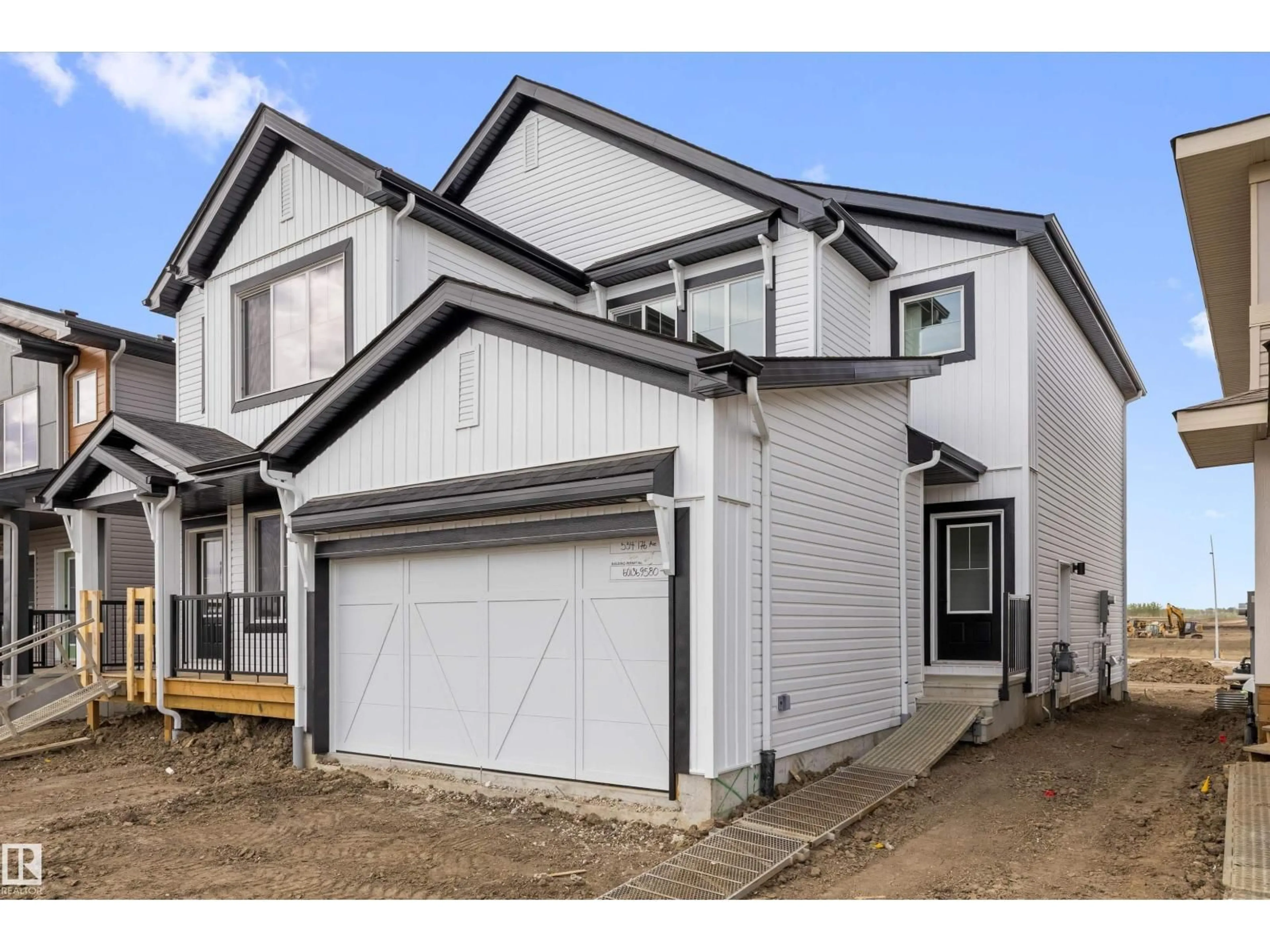 Home with vinyl exterior material, street for NE - 534 176 AV, Edmonton Alberta T5Y4J9