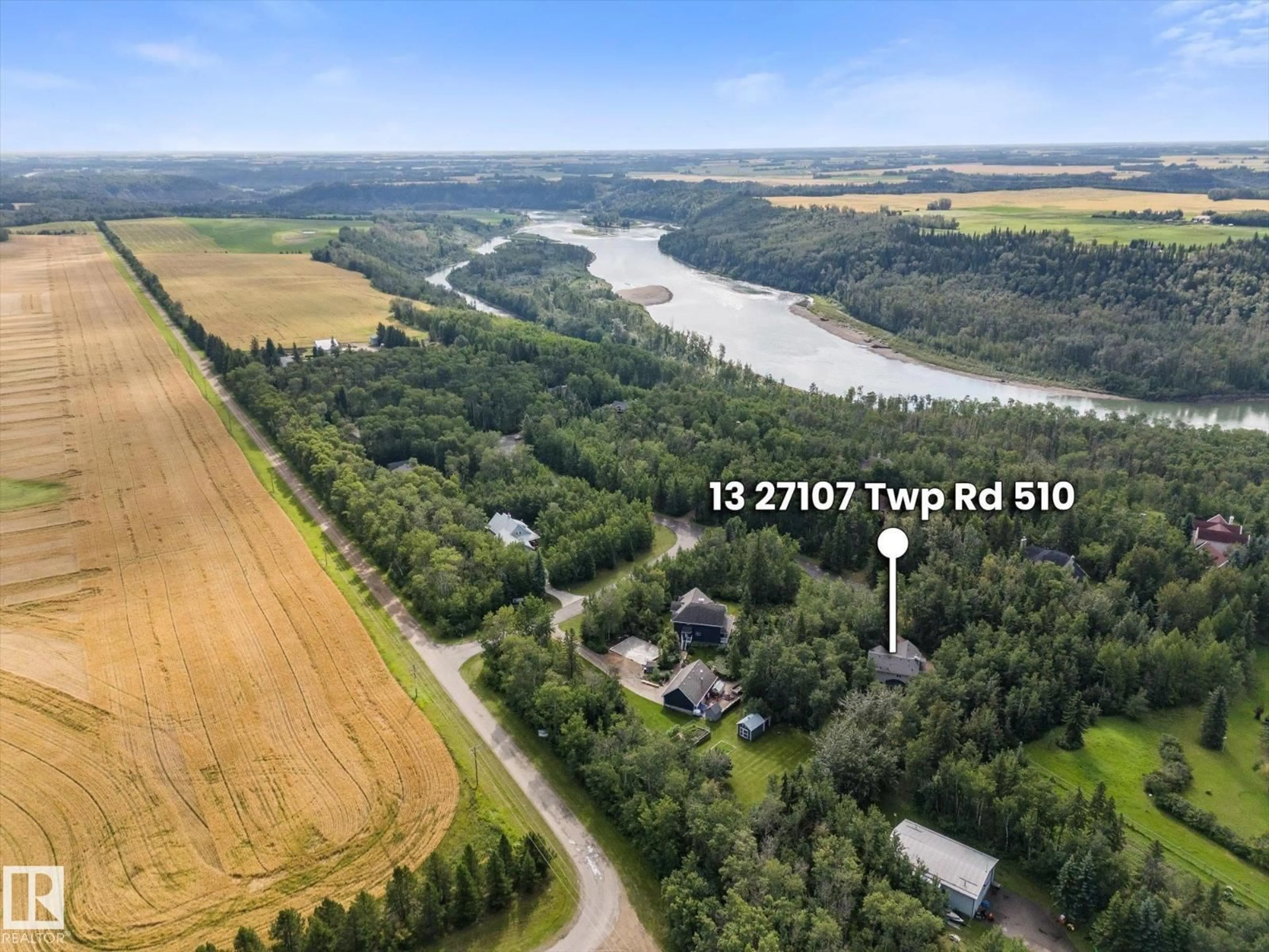 A pic from outside/outdoor area/front of a property/back of a property/a pic from drone, water/lake/river/ocean view for 13 TWP ROAD 510, Rural Parkland County Alberta T7Y1H6