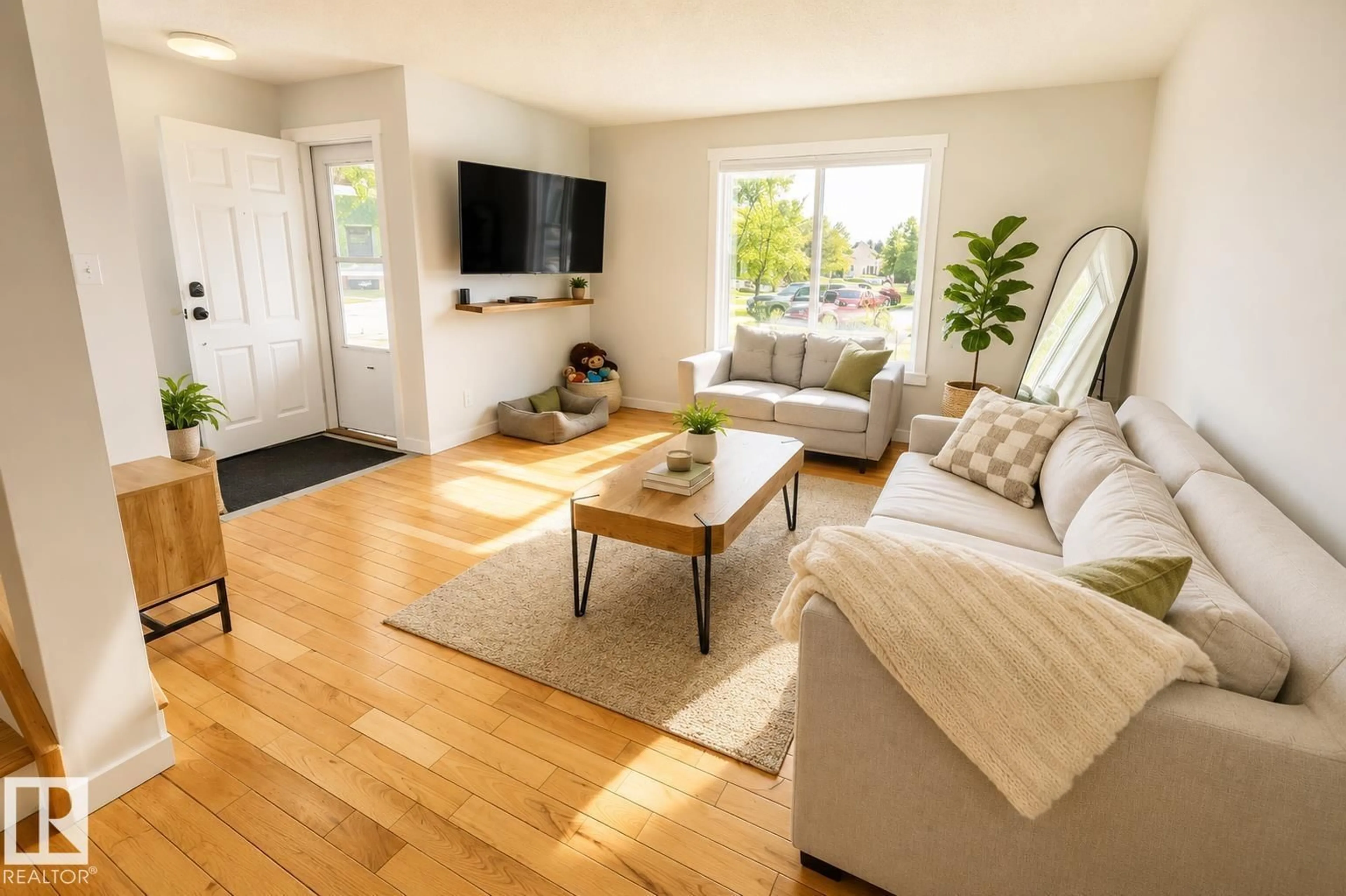 Living room with furniture, wood/laminate floor for NW - 8326 157 AV, Edmonton Alberta T5Z2P7