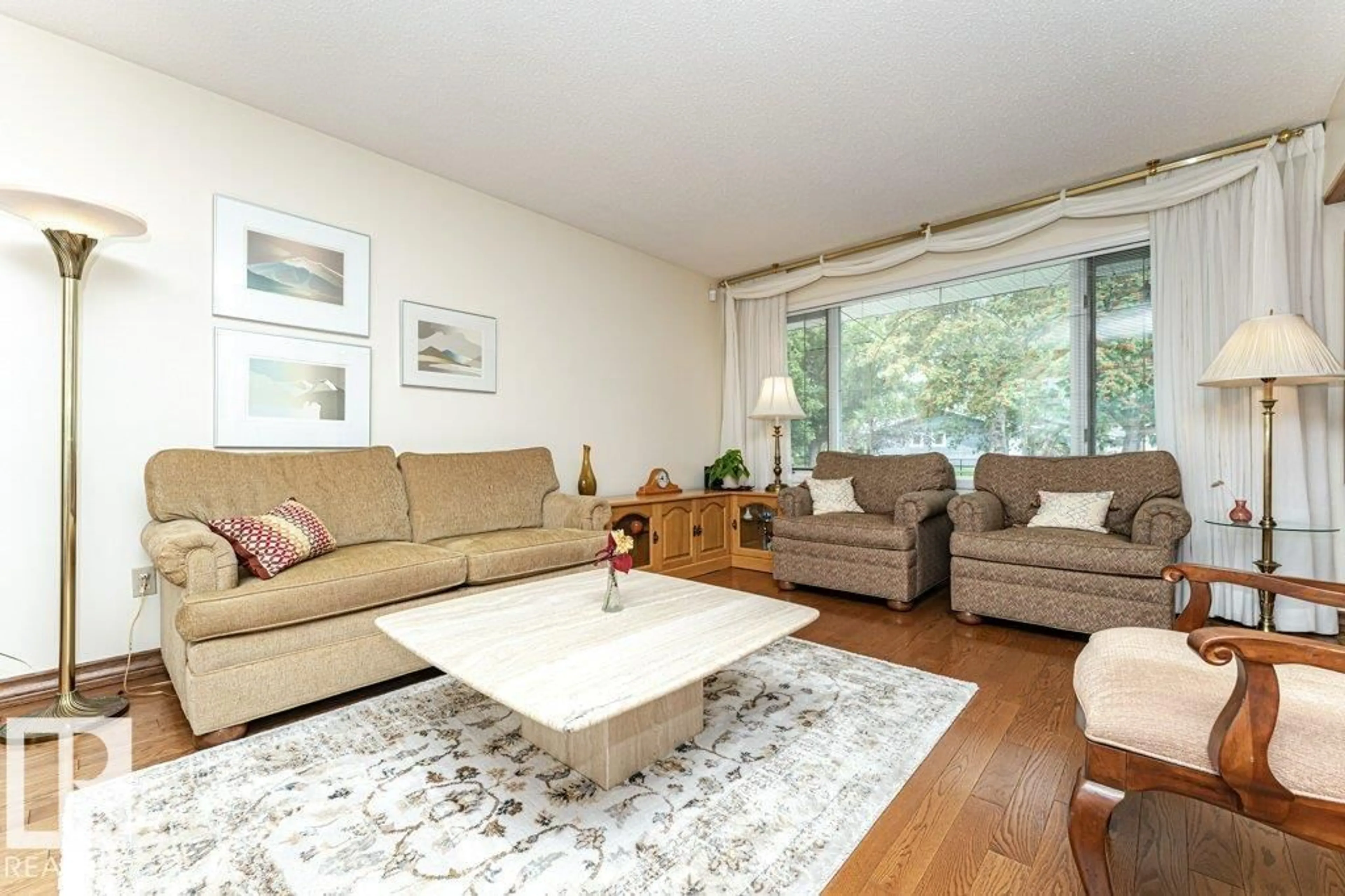 Living room with furniture, wood/laminate floor for 9222 88 ST, Fort Saskatchewan Alberta T8L1H3