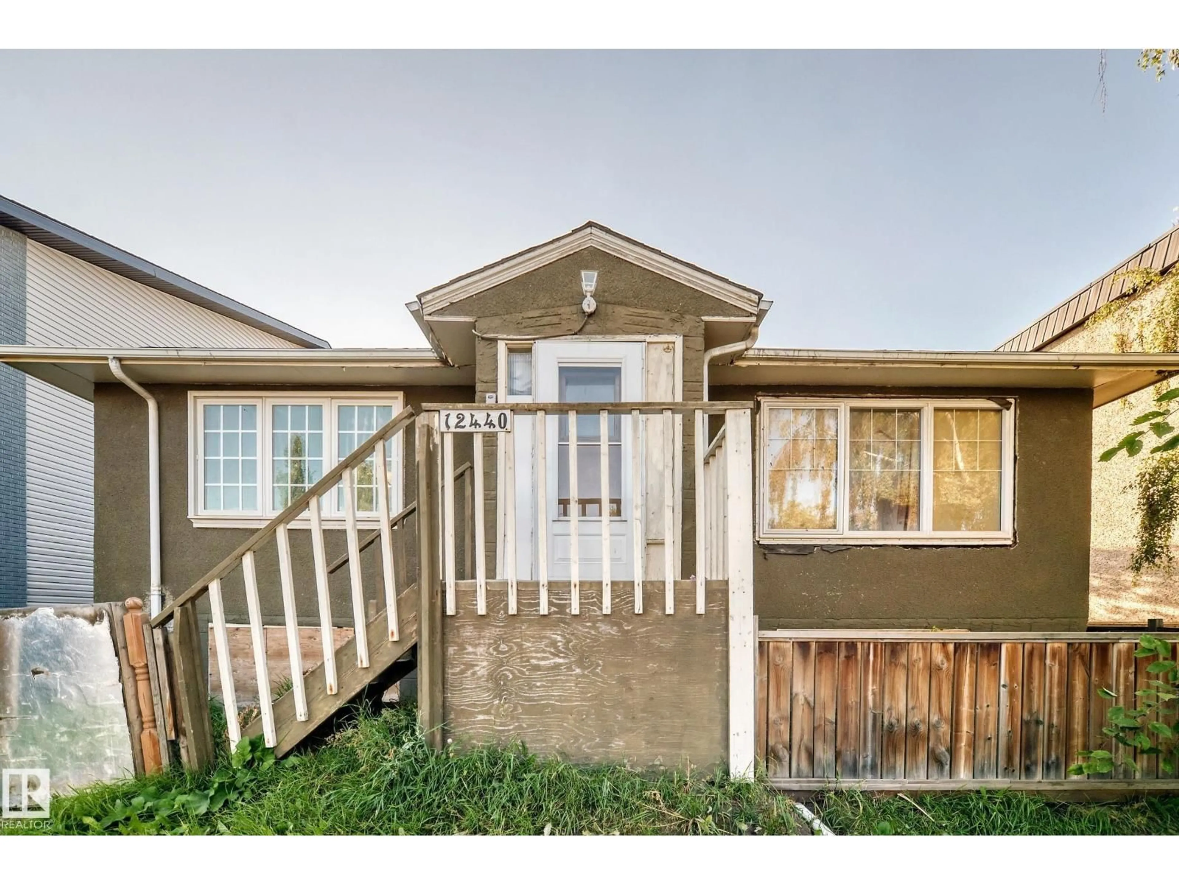 Home with vinyl exterior material, street for 12440 82 ST, Edmonton Alberta T5B2X4