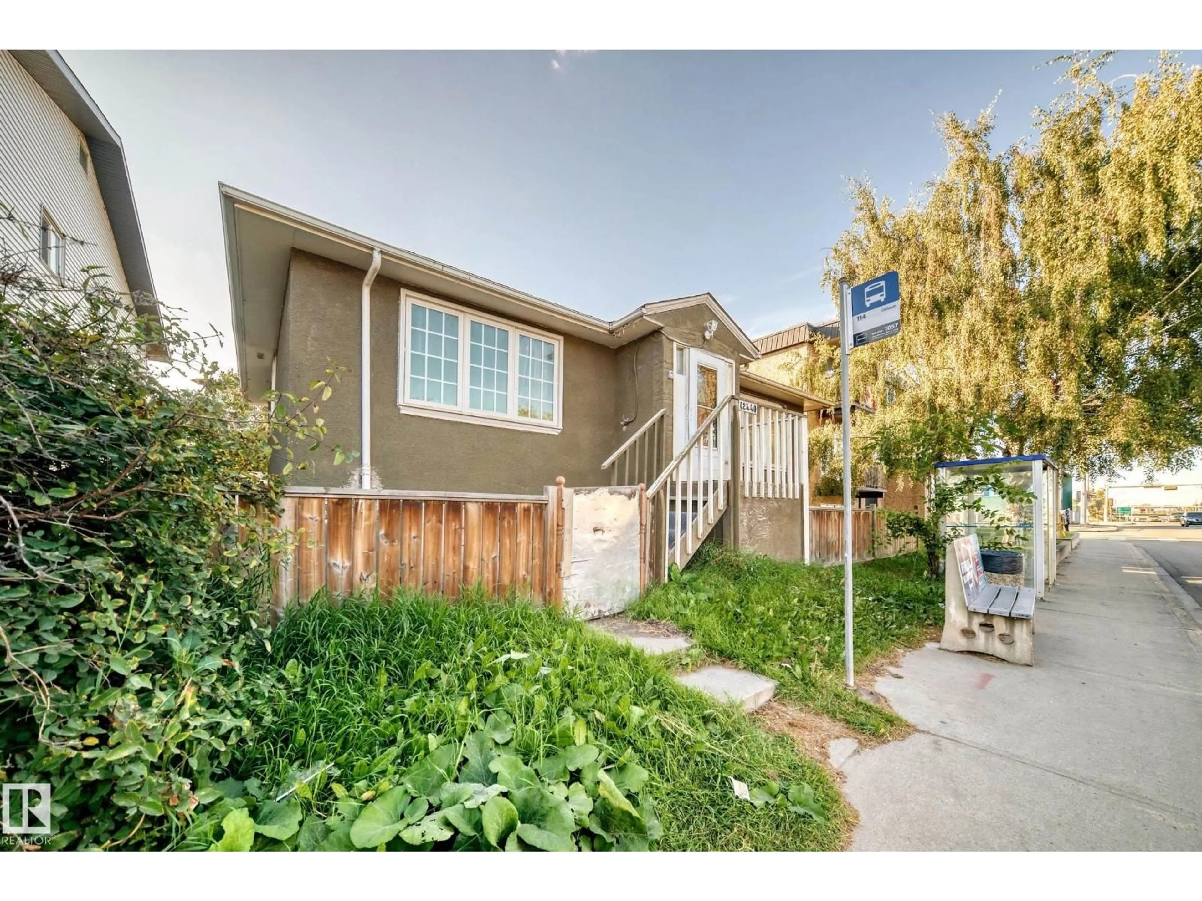 Home with vinyl exterior material, street for 12440 82 ST, Edmonton Alberta T5B2X4