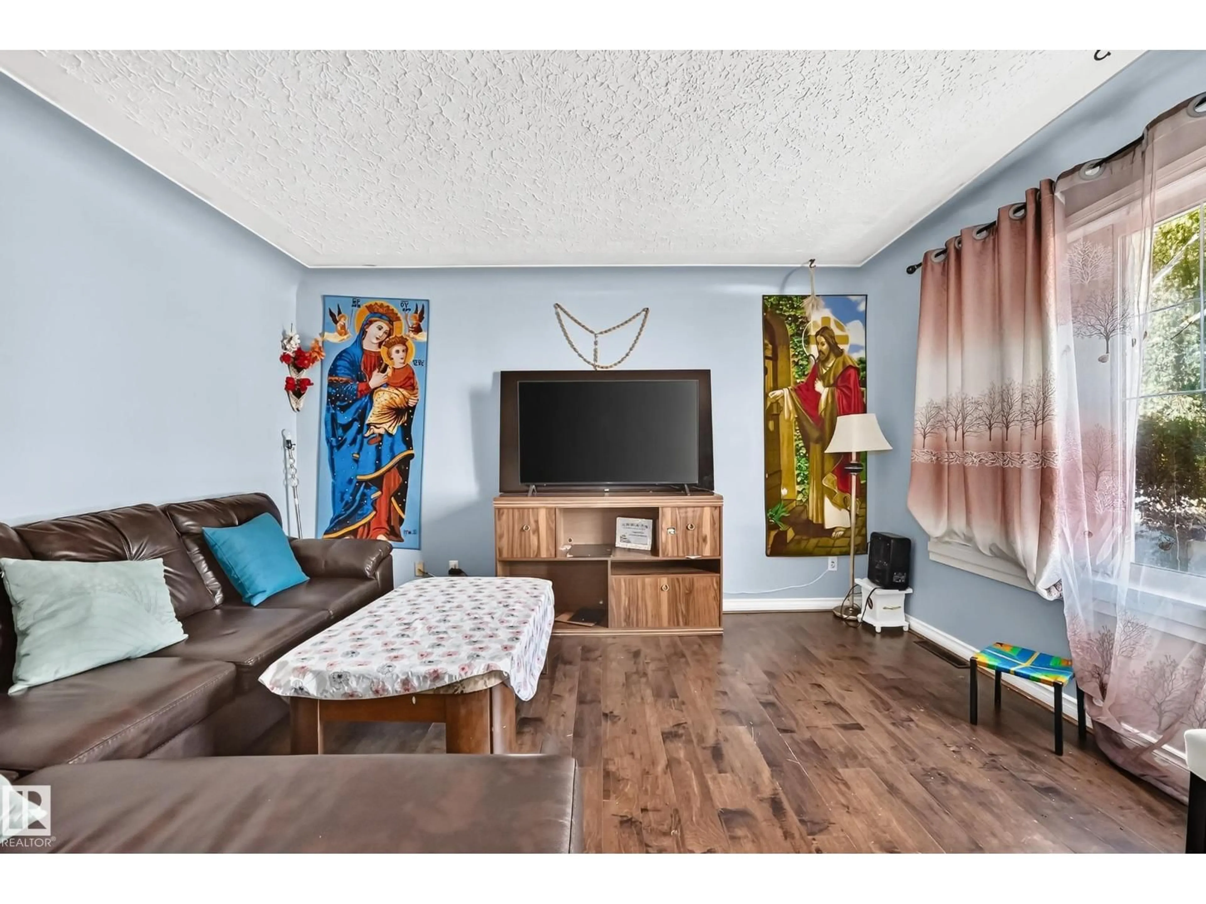 Living room with furniture, wood/laminate floor for 12440 82 ST, Edmonton Alberta T5B2X4