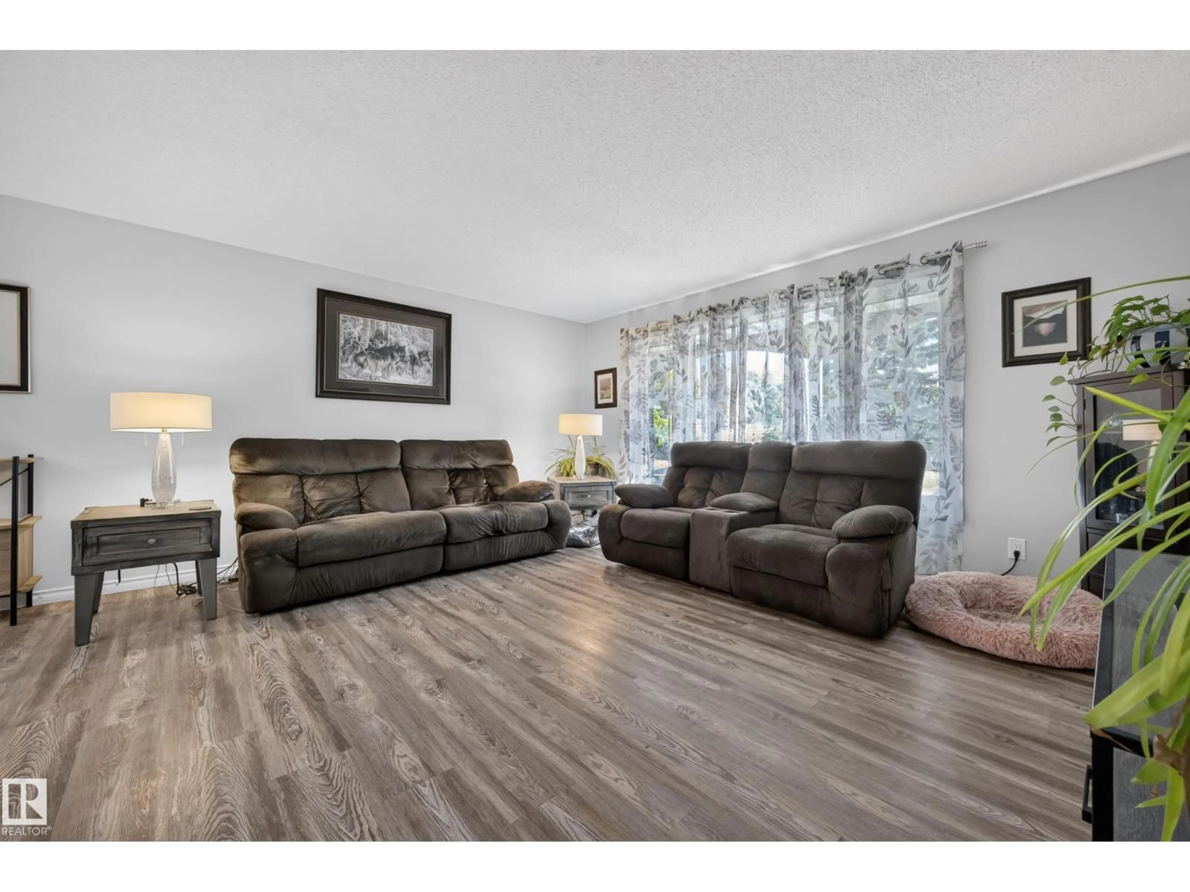 Living room with furniture, wood/laminate floor for 37 GRAHAM RD, Sherwood Park Alberta T8A3N7