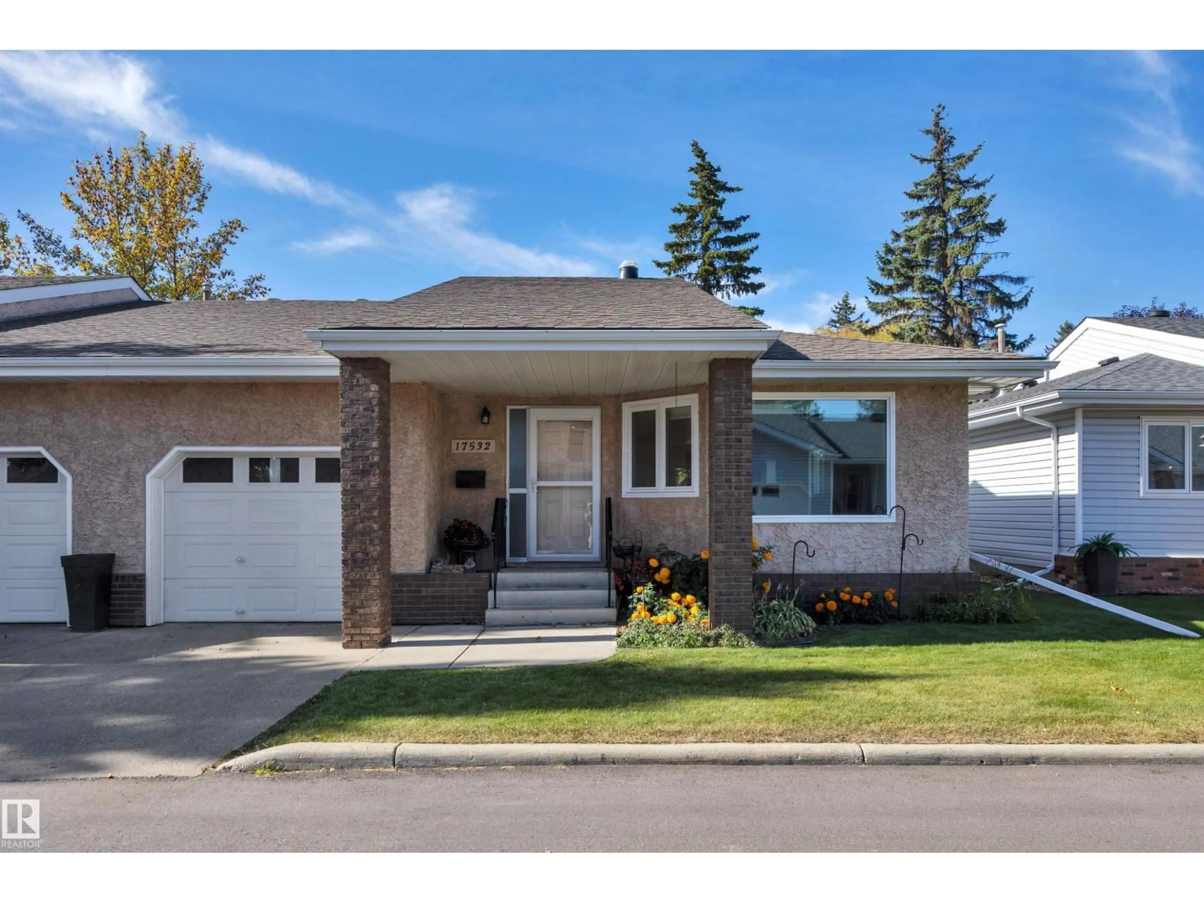 Home with vinyl exterior material, street for 17532 CALLINGWOOD RD, Edmonton Alberta T5T5P1