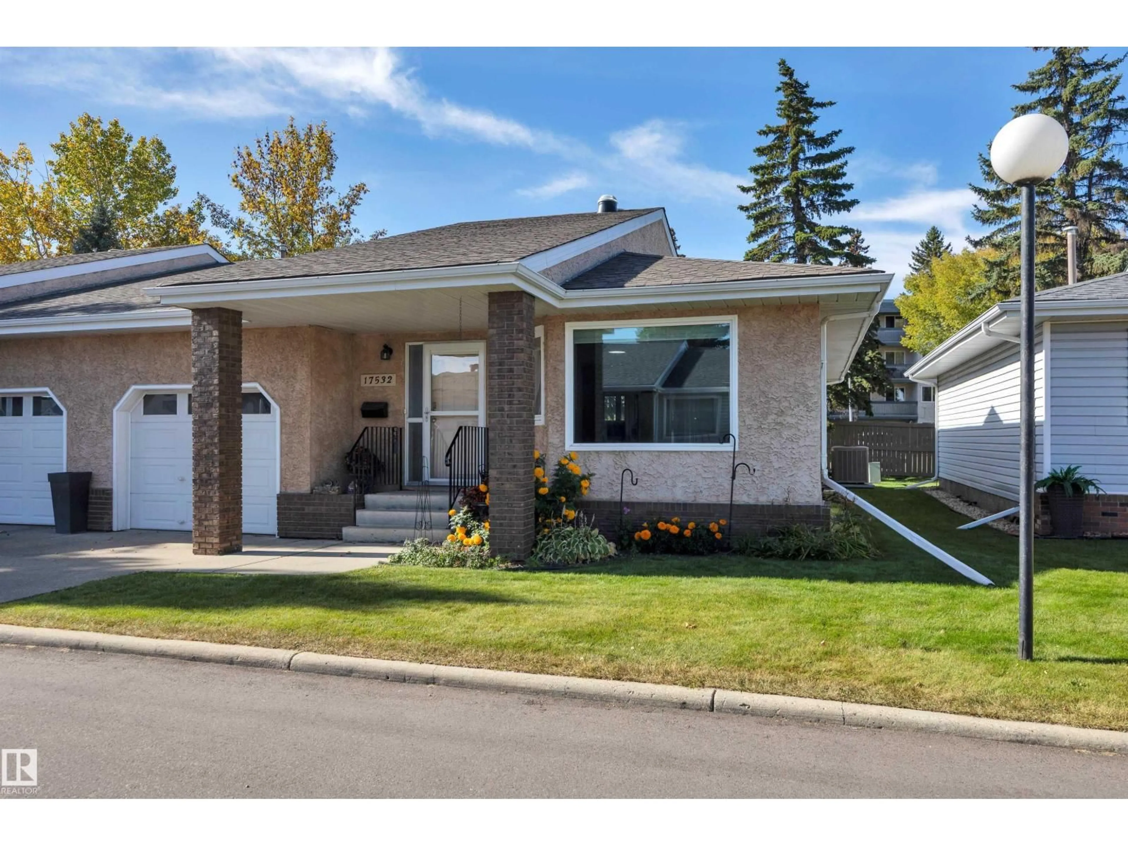 Home with vinyl exterior material, street for 17532 CALLINGWOOD RD, Edmonton Alberta T5T5P1