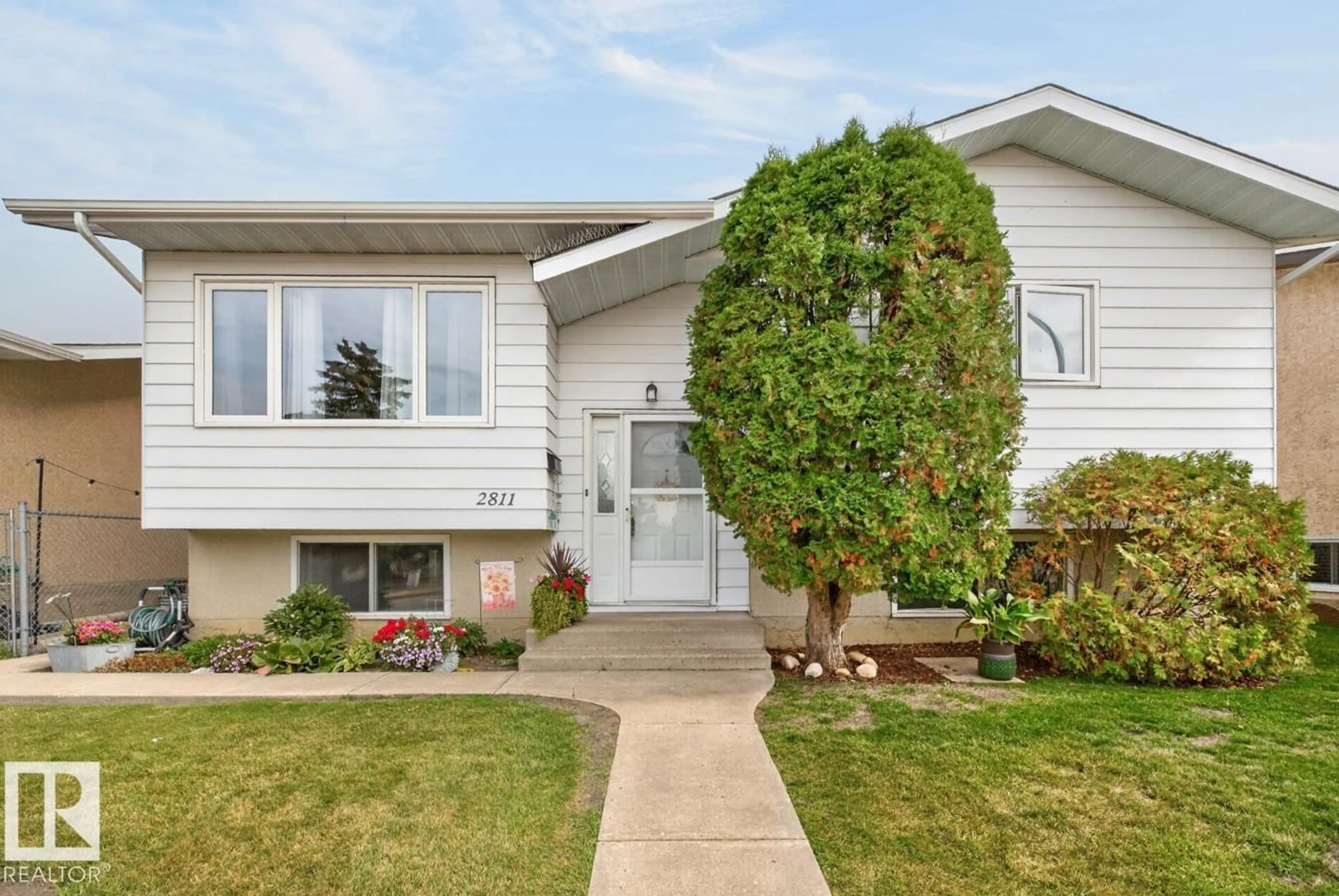 Home with vinyl exterior material, street for NW - 2811 37 ST, Edmonton Alberta T6L4G4