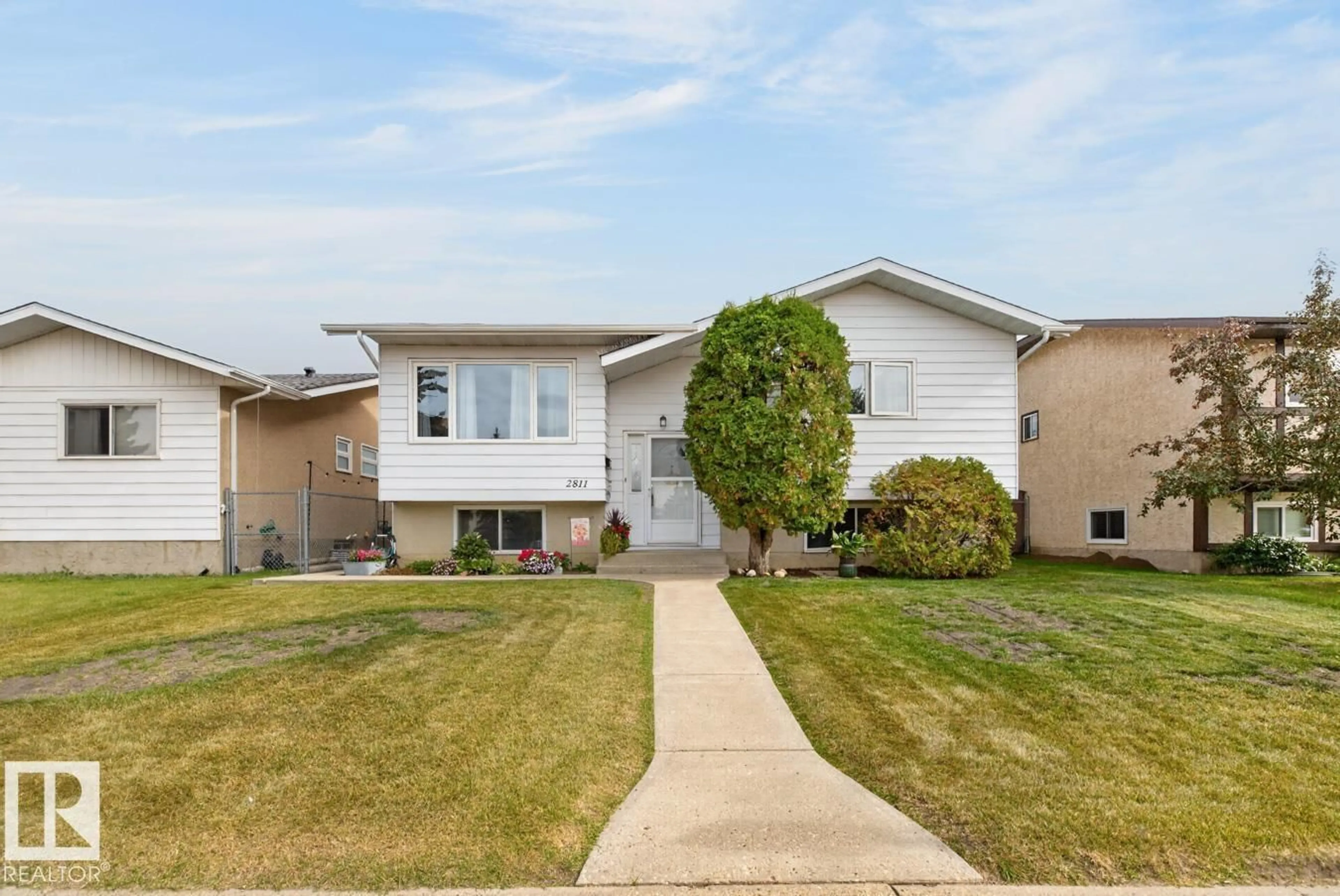 Home with vinyl exterior material, street for NW - 2811 37 ST, Edmonton Alberta T6L4G4