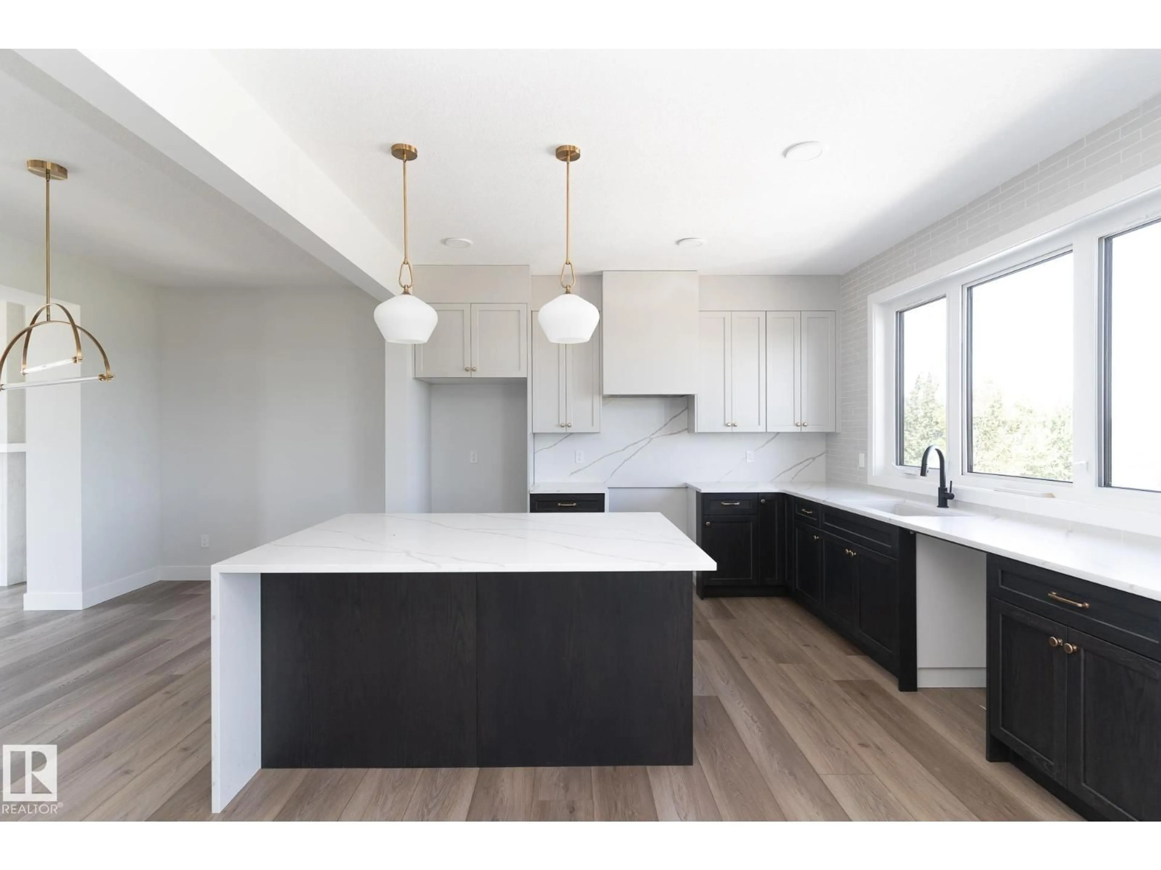 Open concept kitchen, wood/laminate floor for #42 - 7121 MAY CR, Edmonton Alberta T6R0X2