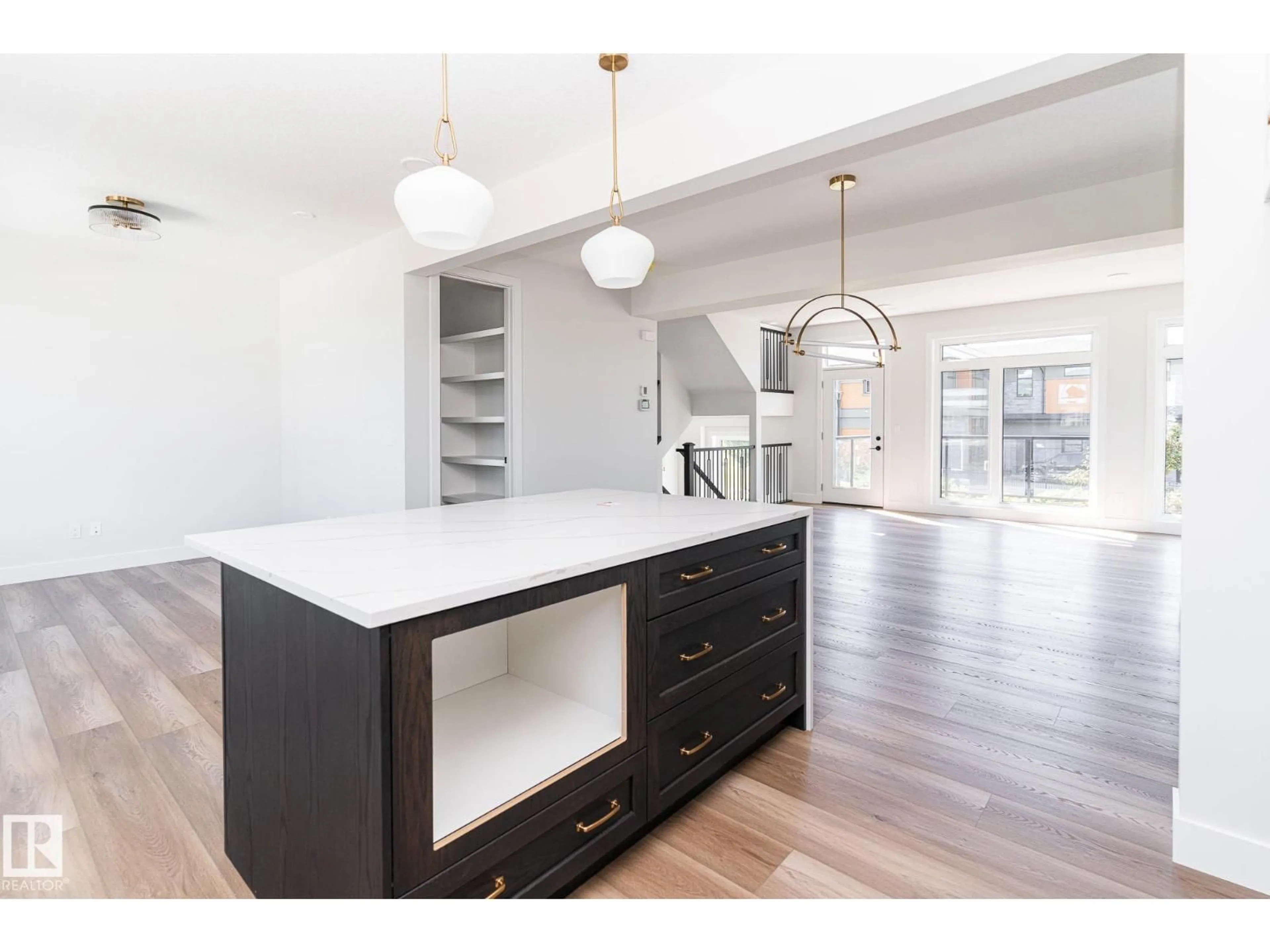 Open concept kitchen, wood/laminate floor for #42 - 7121 MAY CR, Edmonton Alberta T6R0X2