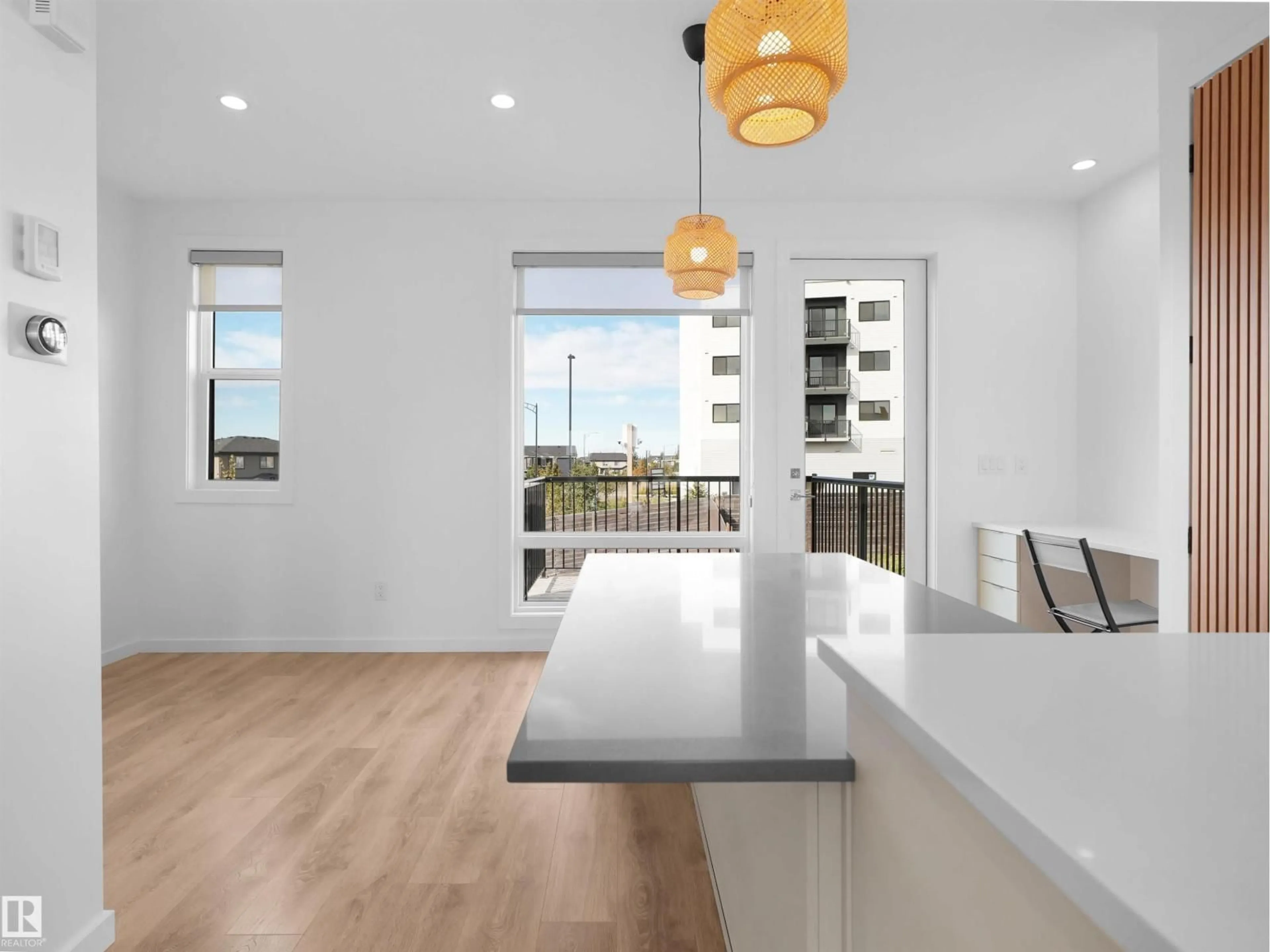 Open concept kitchen, wood/laminate floor for 1704 KEENE CR, Edmonton Alberta T6W3W3