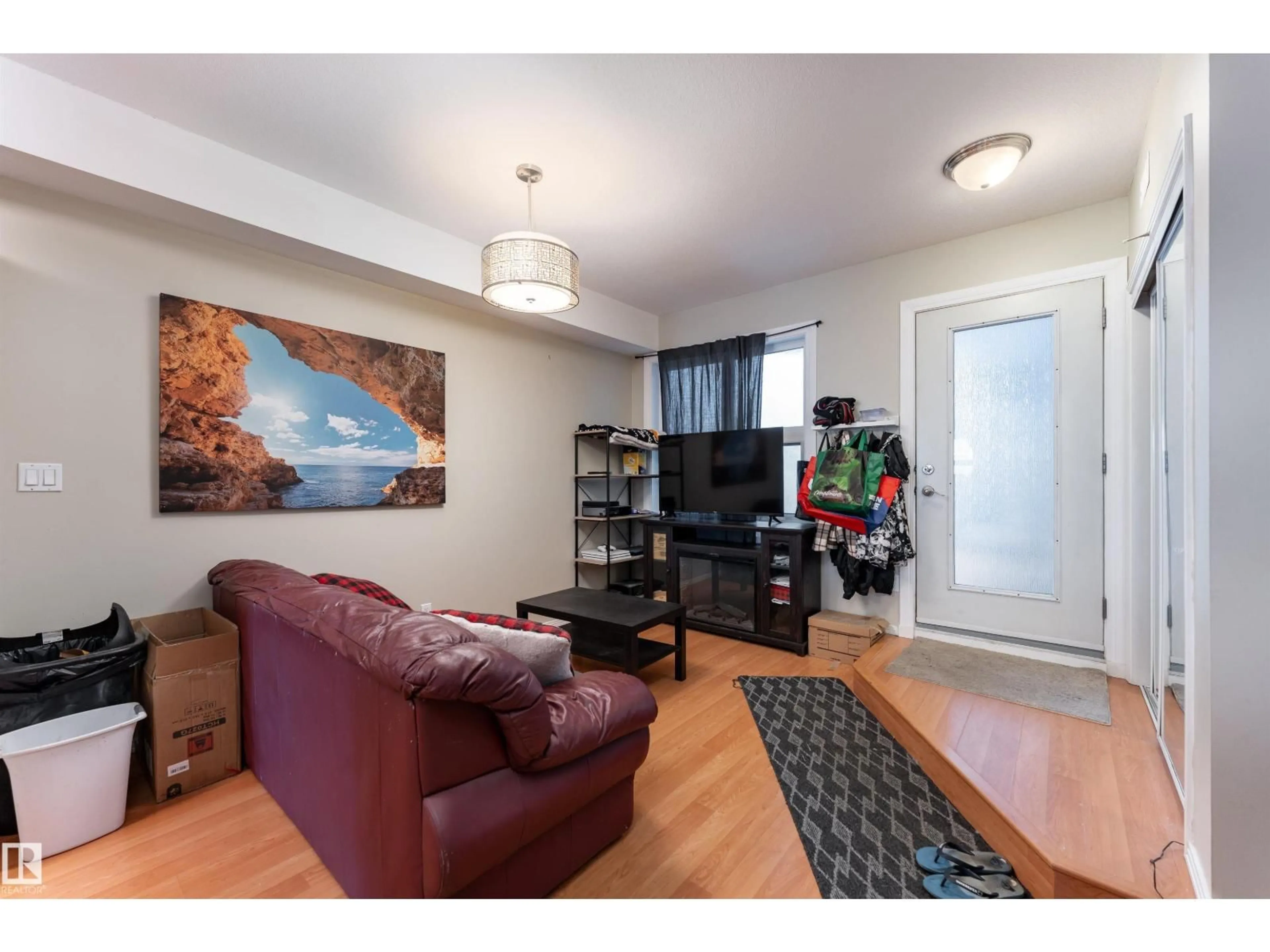 Living room with furniture, wood/laminate floor for #104 - 11933 106 AV, Edmonton Alberta T5H0S2